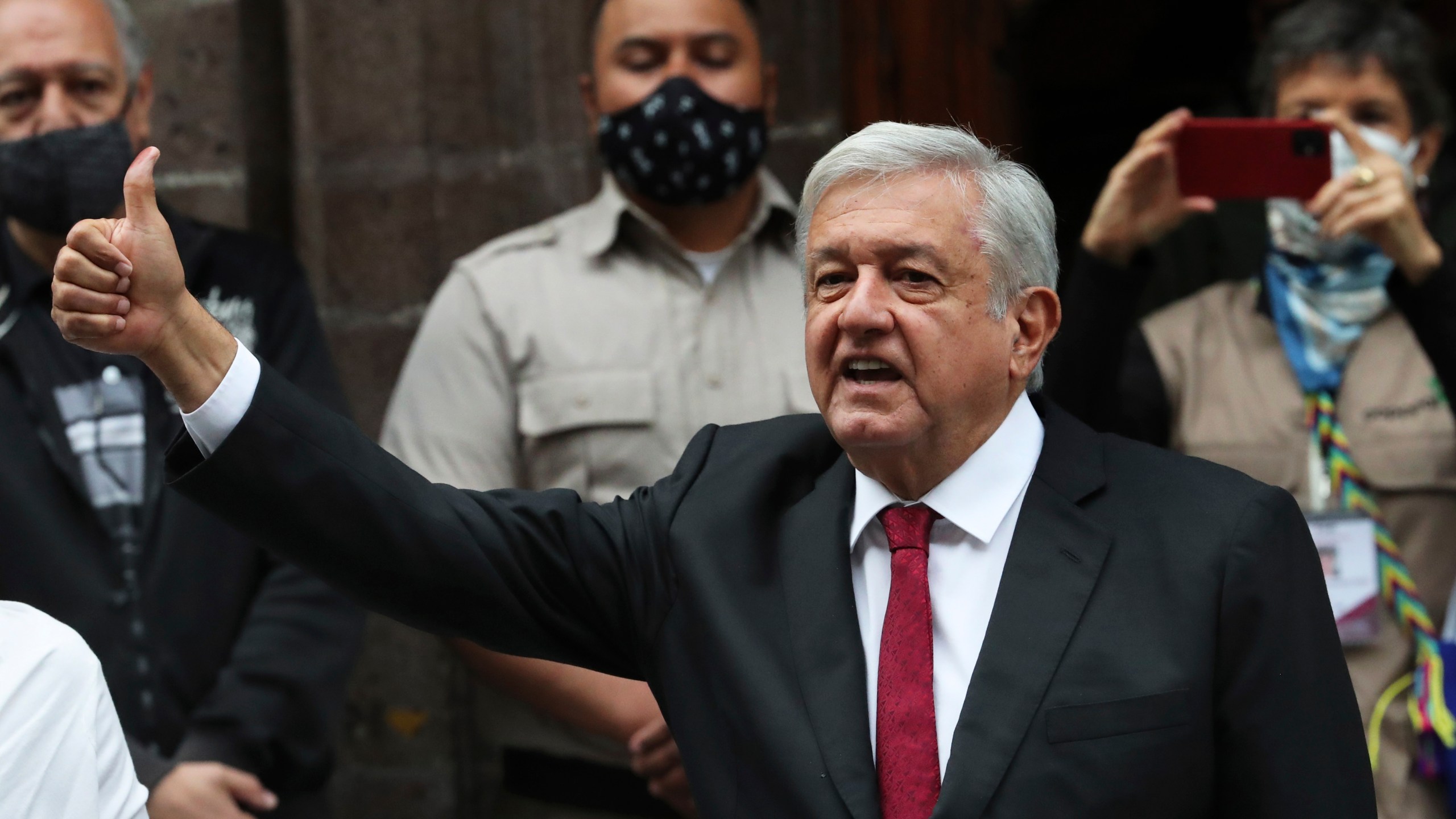 Mexico's President Andrés Manuel López Obrador thumbs up after voting in congressional, state and local elections in Mexico City, Sunday, June 6, 2021. Mexicans on Sunday were electing the entire lower house of Congress, almost half the country's governors and most mayors in a vote that will determine if Obrador's Morena party gets the legislative majority. (AP Photo/Marco Ugarte)