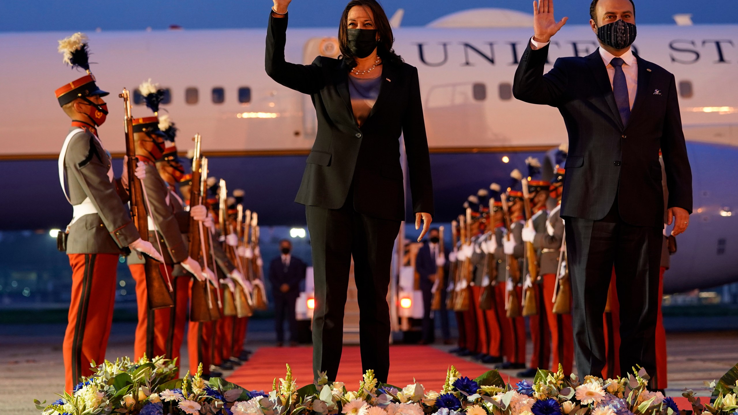 Vice President Kamala Harris and Guatemala's Minister of Foreign Affairs Pedro Brolo wave at her arrival cermony in Guatemala City, Sunday, June 6, 2021, at Guatemalan Air Force Central Command. (AP Photo/Jacquelyn Martin)