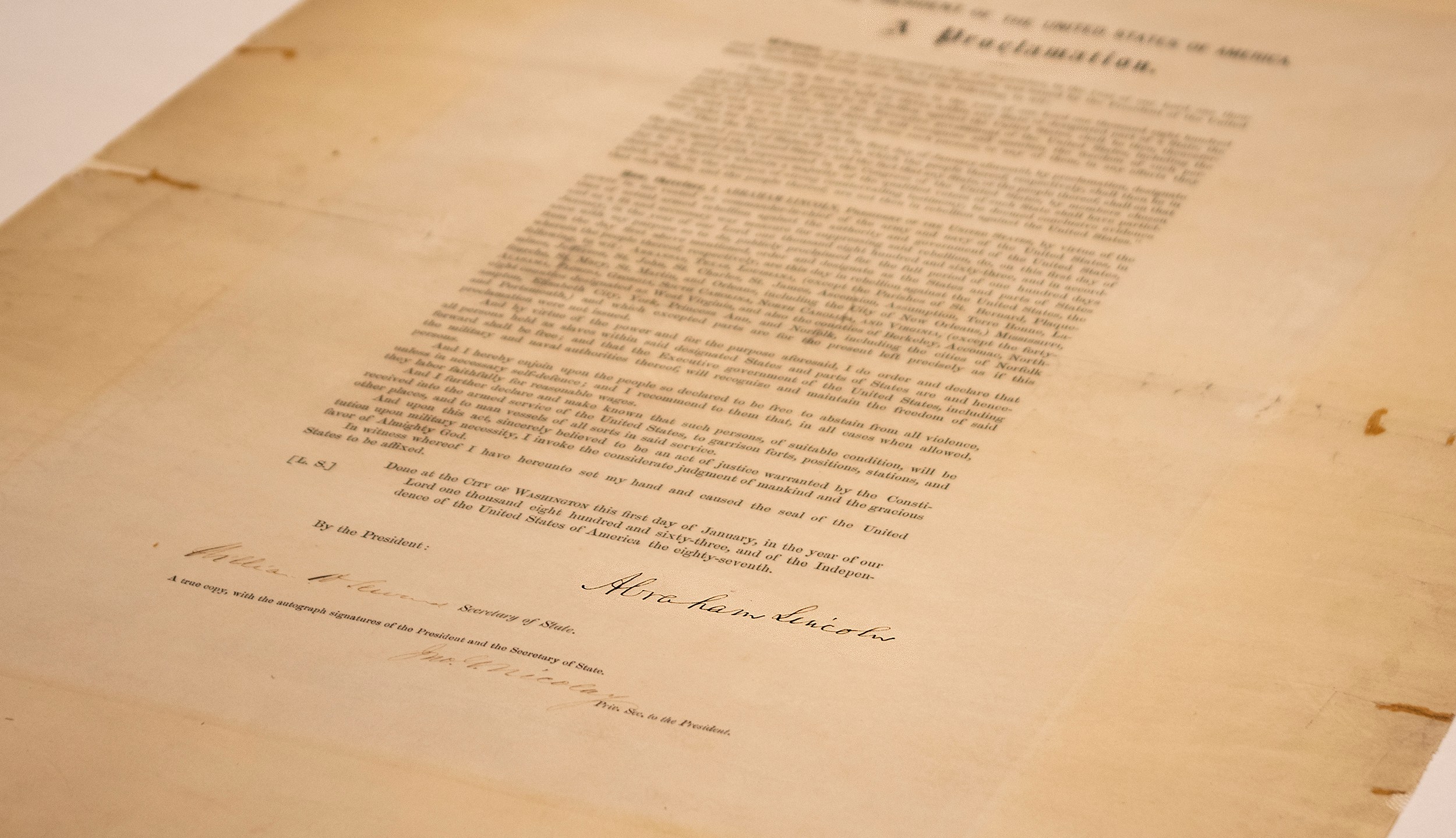 This updated handout photo provided by the Abraham Lincoln Presidential Library and Museum on Tuesday, June 8, 2021 shows a signed copy of Emancipation Proclamation. The Library, in Springfield, Ill., will mark Juneteenth, the holiday commemorating the end of slavery in the United States, by displaying the rare signed copy of the Emancipation Proclamation. The copy of the proclamation that's signed by Lincoln and Secretary of State William Seward will be displayed between June 15 and July 6. The original document is kept in the National Archives in Washington, D.C. (Abraham Lincoln Presidential Library and Museum photo via AP)