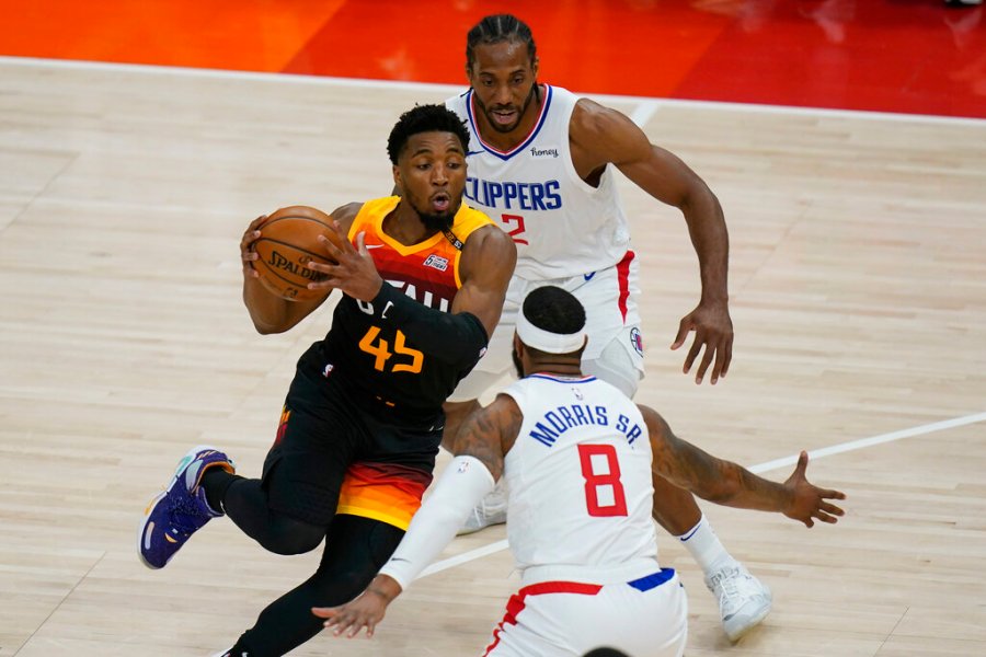 Los Angeles Clippers' Kawhi Leonard (2) and Marcus Morris Sr. (8) defend against Utah Jazz guard Donovan Mitchell (45) during the first half of Game 1 of a second-round NBA basketball playoff series Tuesday, June 8, 2021, in Salt Lake City. (AP Photo/Rick Bowmer)