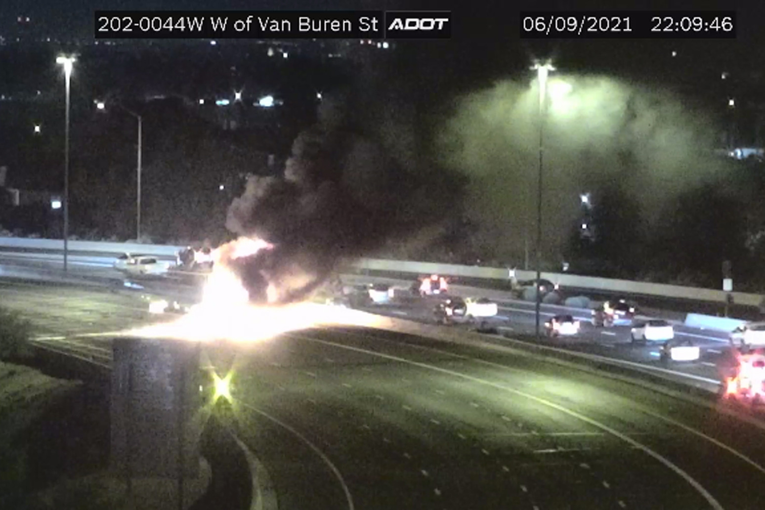 This image from an Arizona Department of Transportation remote traffic camera shows the scene of a crash involving a milk tanker truck in Phoenix on Wednesday, June 9, 2021. Authorities say the milk tanker truck going too fast for traffic conditions collided with seven other vehicles on a freeway. (Arizona Department of Transportation via AP).