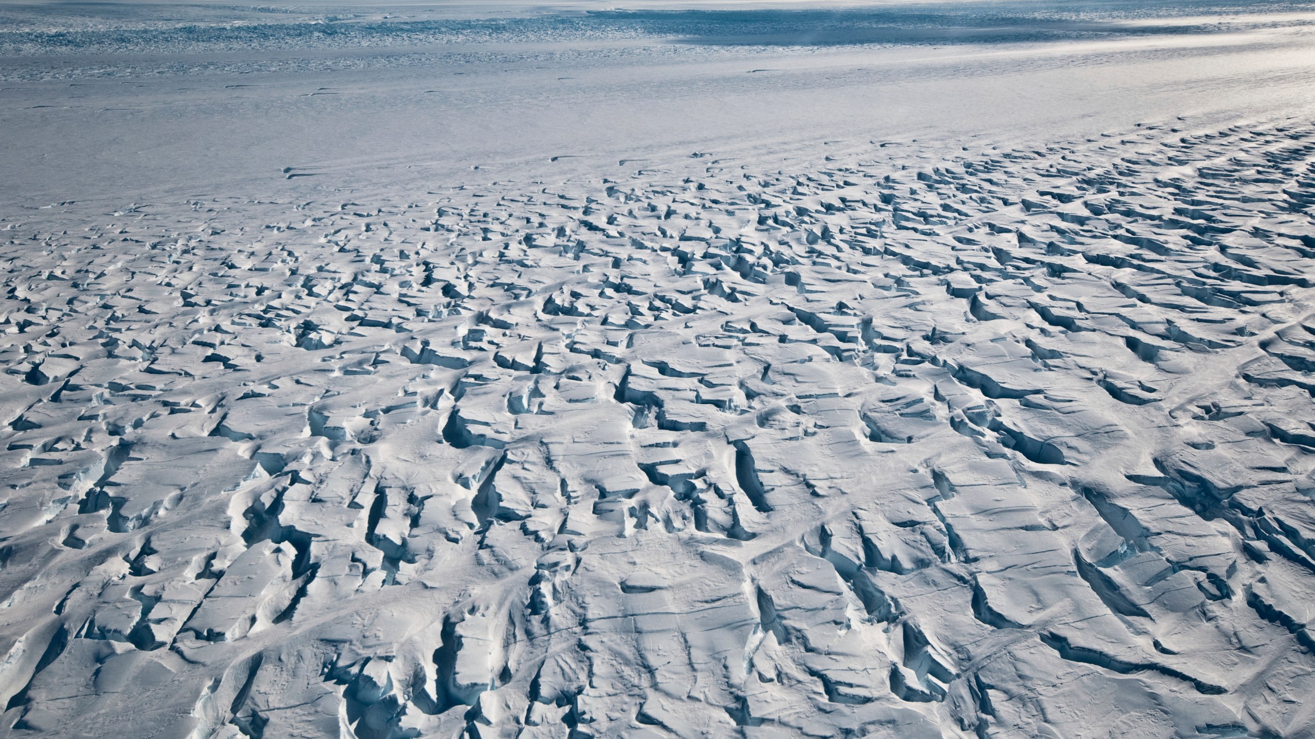 This January 2010 photo provided by Ian Joughin shows the area near the grounding line of the Pine Island Glacier along its west side in Antarctica. According to a study published in the Friday, June 11, 2021 issue of Science Advances, the critical Antarctic glacier is looking more vulnerable as satellite images show the ice shelf that blocks it from collapsing into the sea is breaking up much faster than before and spawning huge icebergs. (Ian Joughin via AP)