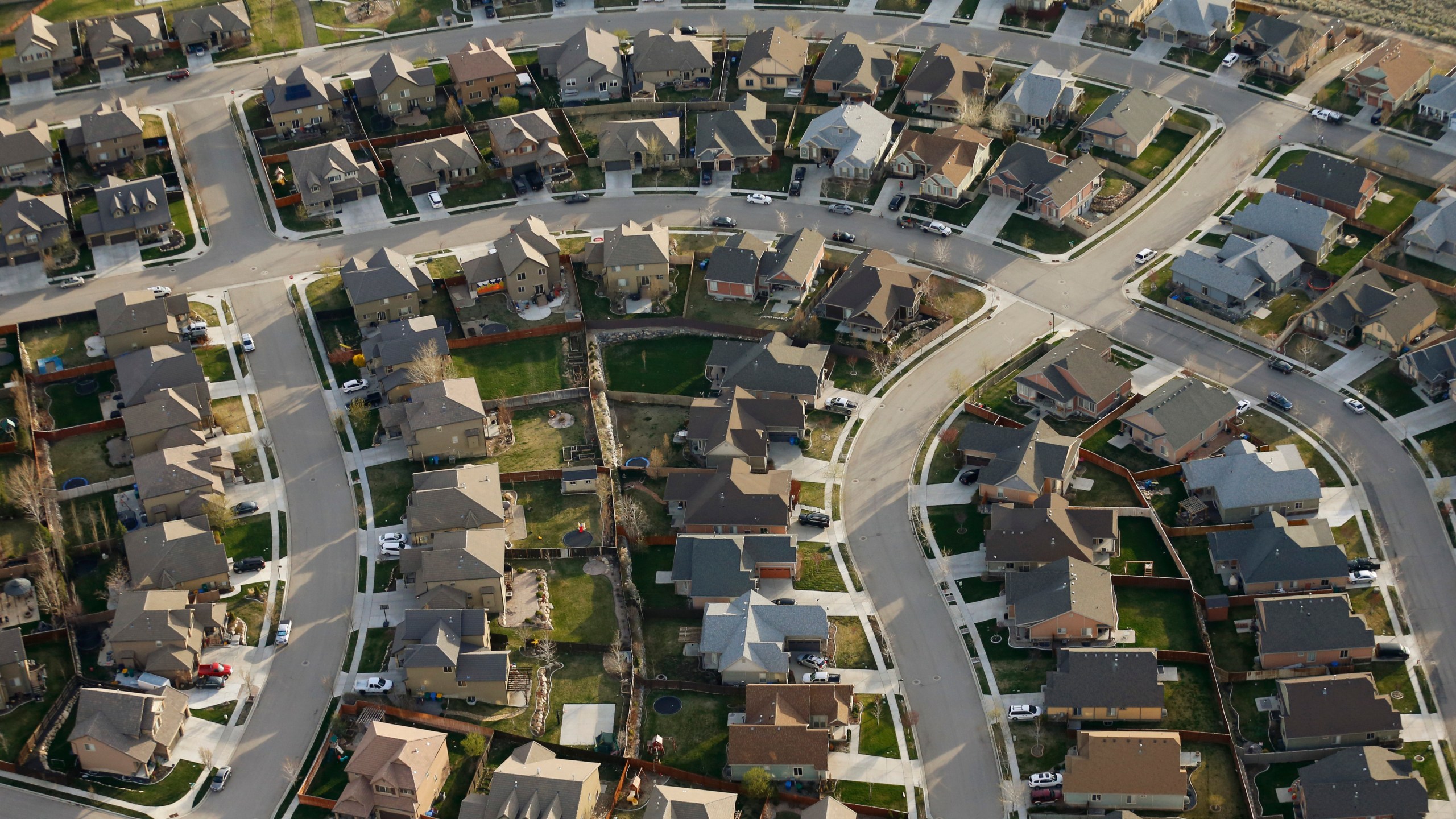 This April 13, 2019, file photo, shows homes in suburban Salt Lake City. (AP Photo/Rick Bowmer, File)