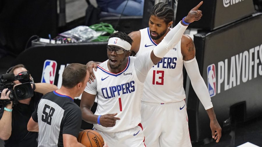 Los Angeles Clippers guard Reggie Jackson (1) argues with referee Josh Tiven (58) during the first half of Game 5 of the team's second-round NBA basketball playoff series against the Utah Jazz on June 16, 2021, in Salt Lake City. (Rick Bowmer / Associated Press)