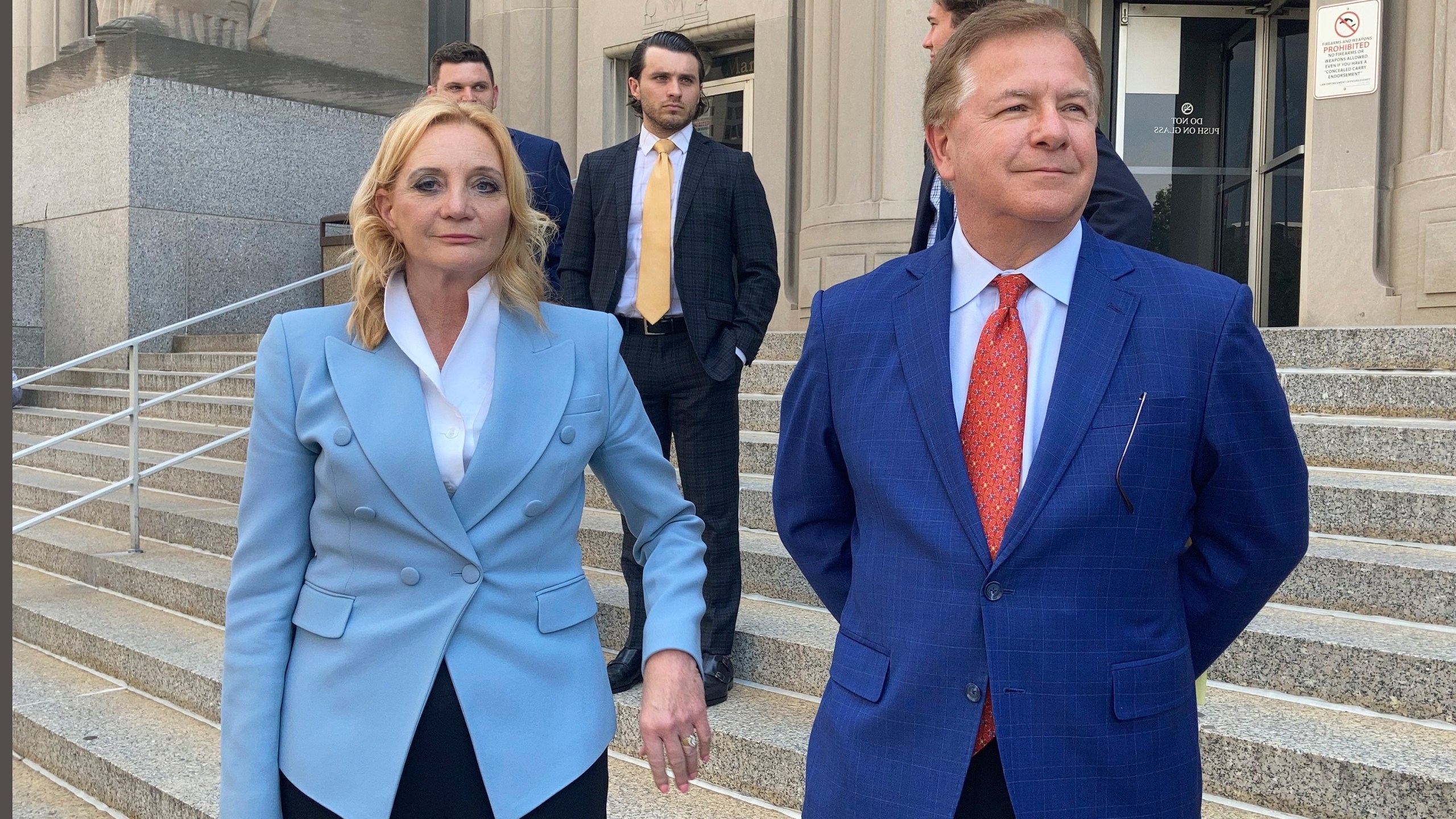 Patricia McCloskey, left, and her husband Mark McCloskey leave a court in St. Louis on June 17, 2021. (Jim Salter/Associated Press)