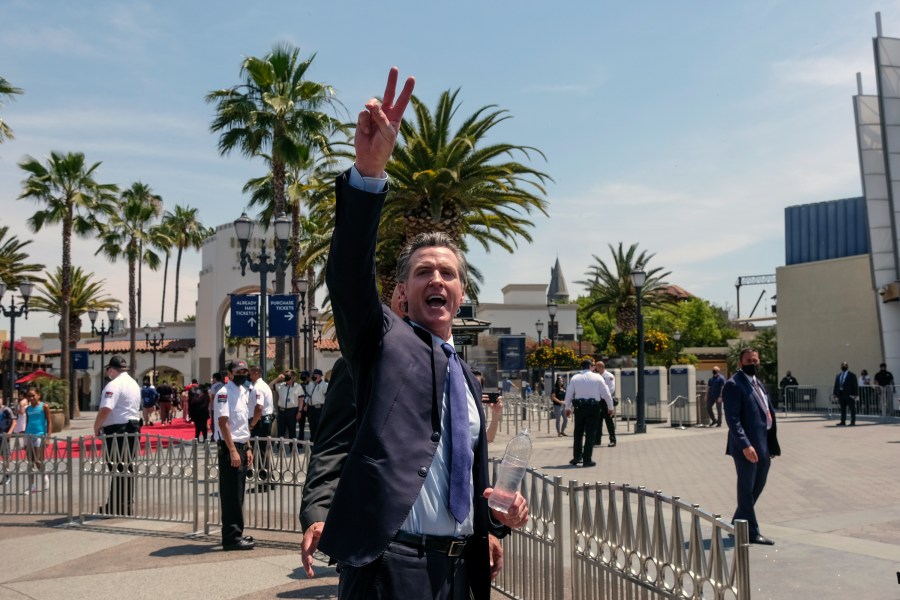 In this June 15, 2021, file photo California Gov. Gavin Newsom gestures after a news conference at Universal Studios in Universal City, Calif. (AP Photo/Ringo H.W. Chiu, File)