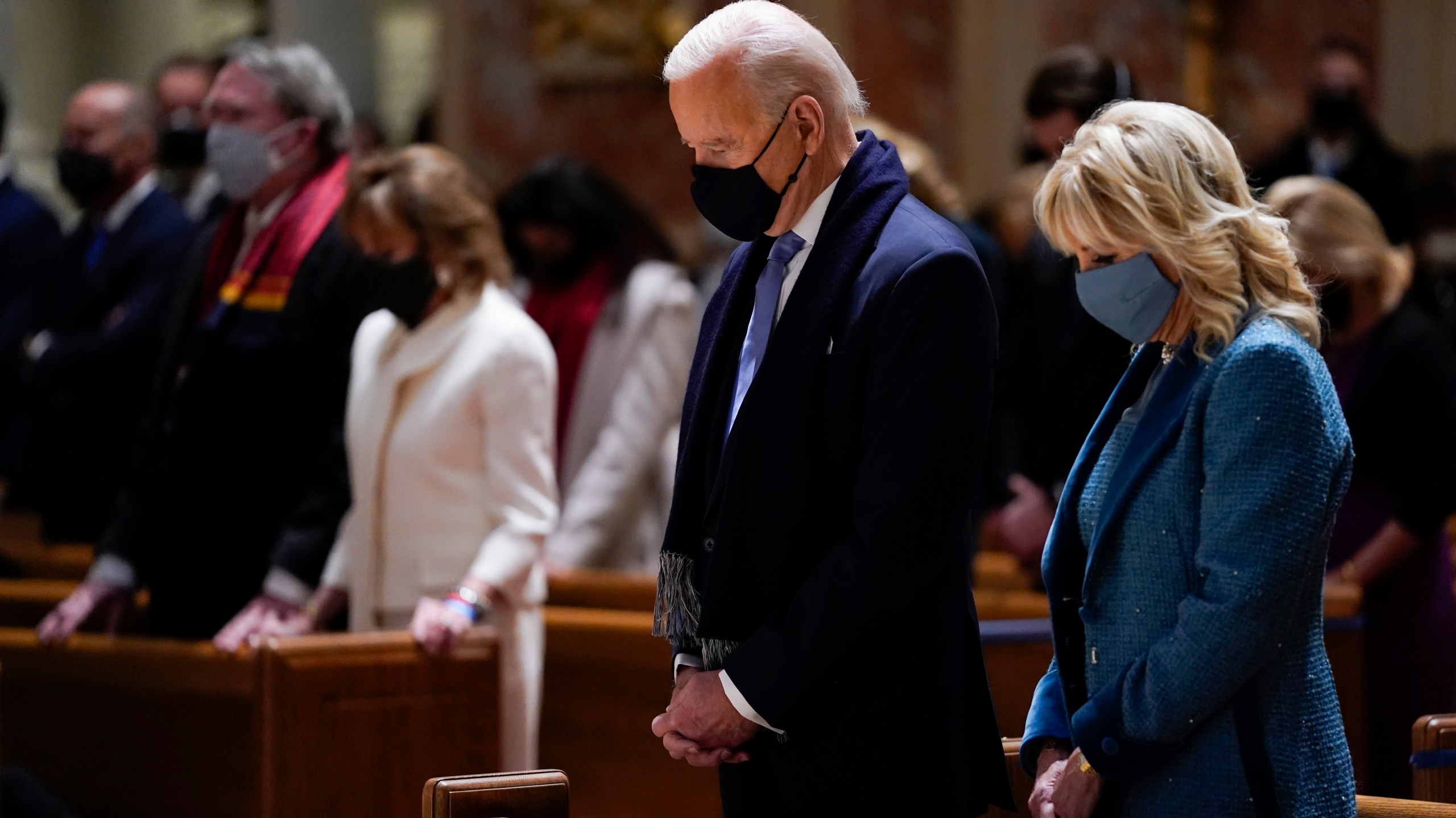 In this Jan. 20, 2021 file photo, President-elect Joe Biden and his wife, Jill Biden, attend Mass at the Cathedral of St. Matthew the Apostle during Inauguration Day ceremonies in Washington. (Evan Vucci, File)