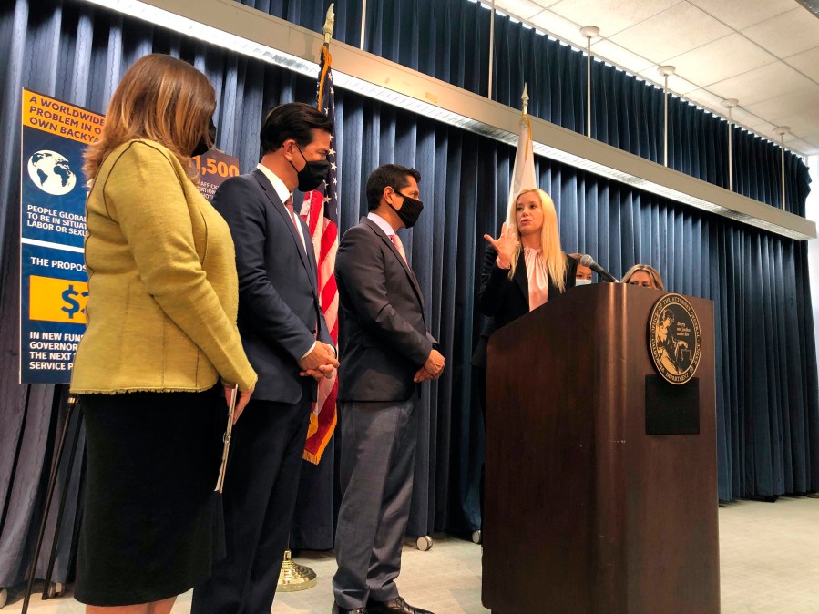 Actress Mira Sorvino at podium, joins actors and activists to discuss new efforts to stop human trafficking in California on Friday, June 18, 2021, in Los Angeles. (AP Photo/Stefanie Dazio)