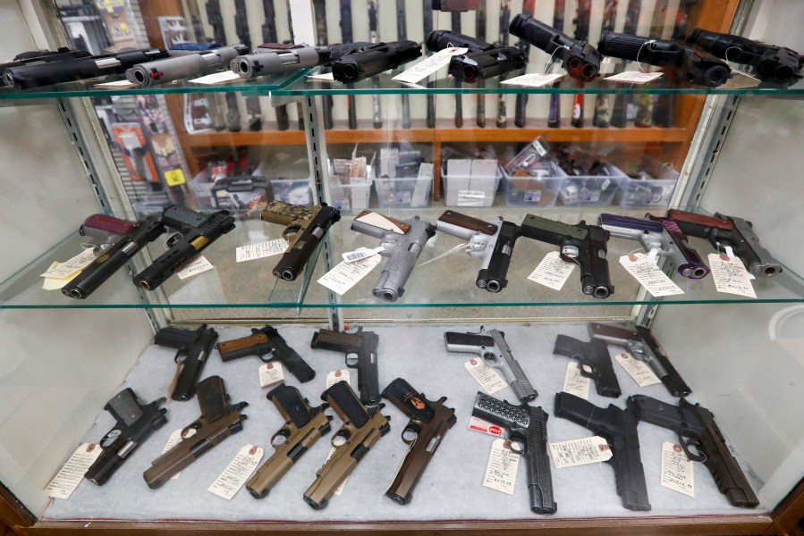 In this March 25, 2020, file photo semi-automatic handguns are displayed at shop in New Castle, Pa. (AP Photo/Keith Srakocic, File)