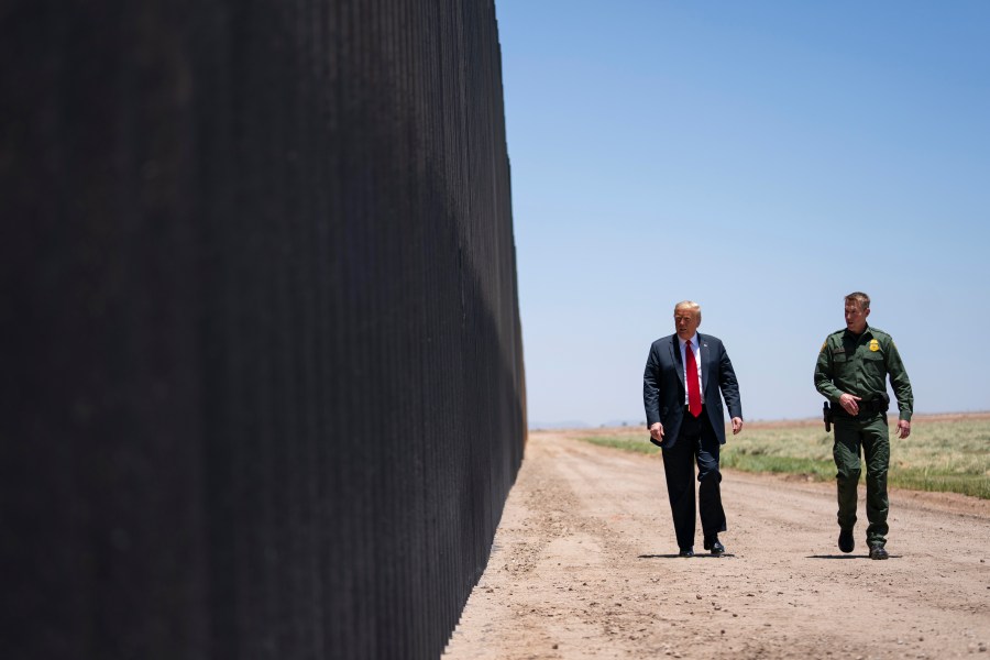 In this June 23, 2020 file photo, U.S. Border Patrol chief Rodney Scott gives President Donald Trump a tour of a section of the border wall in San Luis, Ariz. (Evan Vucci/Associated Press)