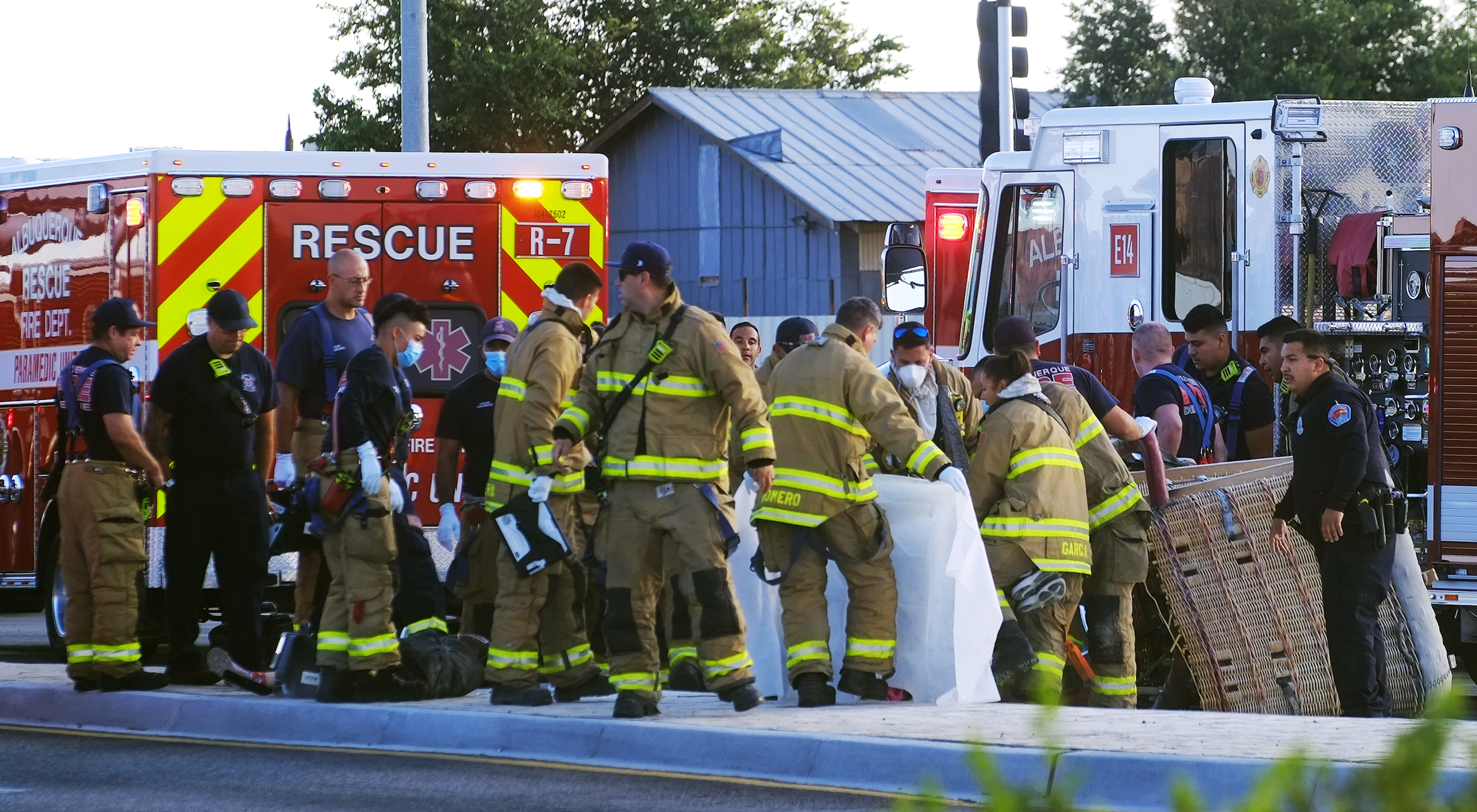 Albuquerque Fire Rescue crews work on victims of the fatal balloon crash at Unser and Central SW in Albuquerque, N.M., on Saturday, June 26, 2021. Multiple people were killed in the crash. (Adolphe Pierre-Louis/The Albuquerque Journal via AP)