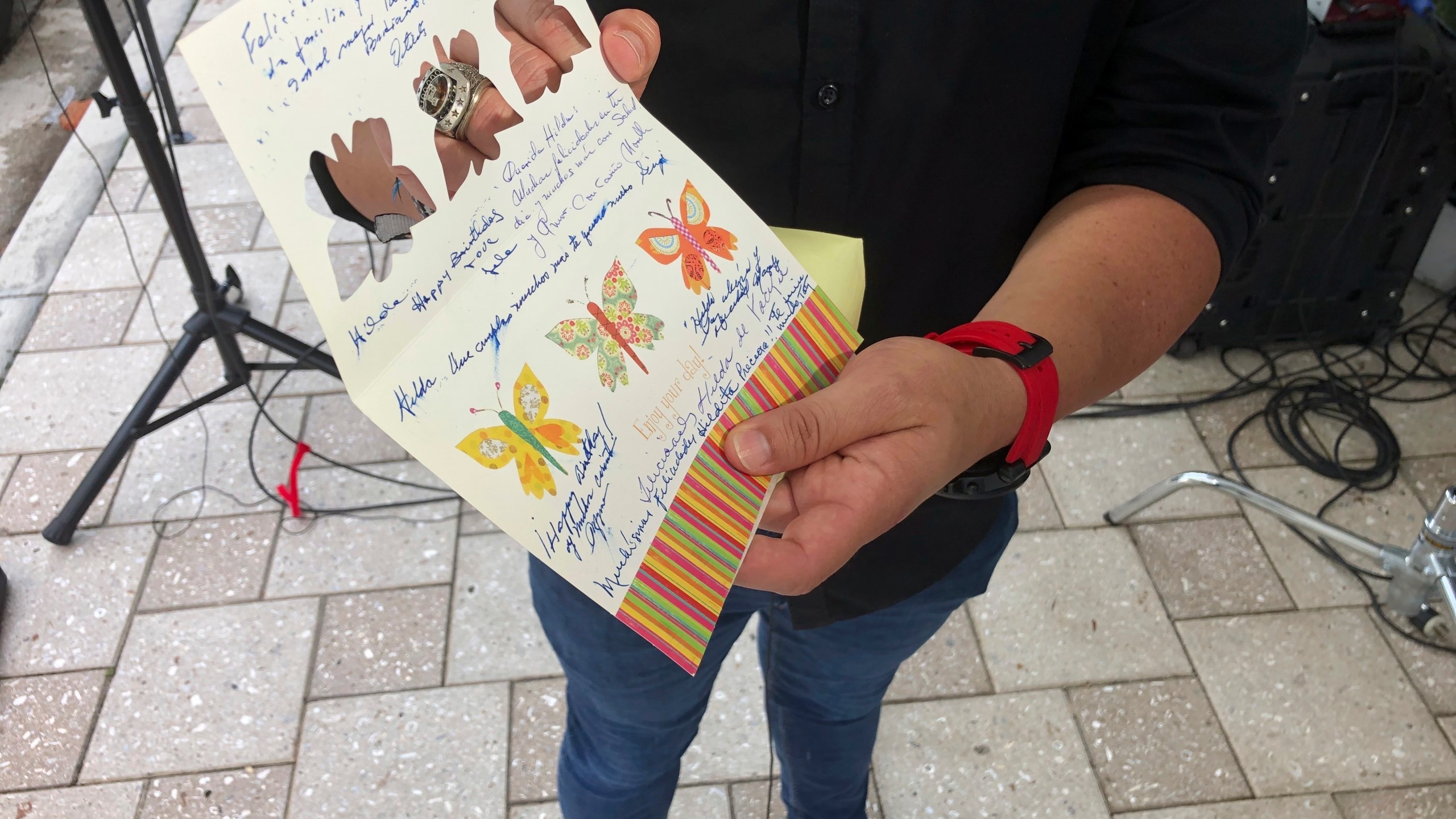 Mike Noriega shows a birthday card, Saturday, June 26, 2021, in Surfside, Fla., relatives sent to his grandmother, Hilda Noriega, two weeks ago for her 92nd birthday. Hilda Noriega lives on the sixth floor of the Miami building that collapsed. (AP Photo/Joshua Goodman)