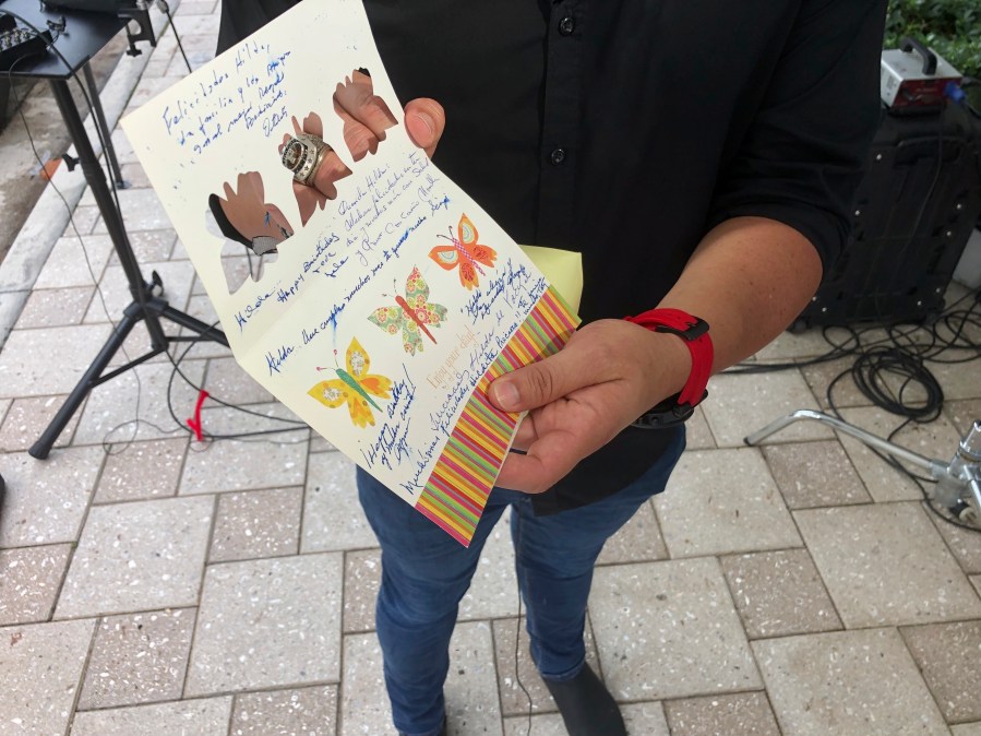 Mike Noriega shows a birthday card, Saturday, June 26, 2021, in Surfside, Fla., relatives sent to his grandmother, Hilda Noriega, two weeks ago for her 92nd birthday. Hilda Noriega lives on the sixth floor of the Miami building that collapsed. (AP Photo/Joshua Goodman)