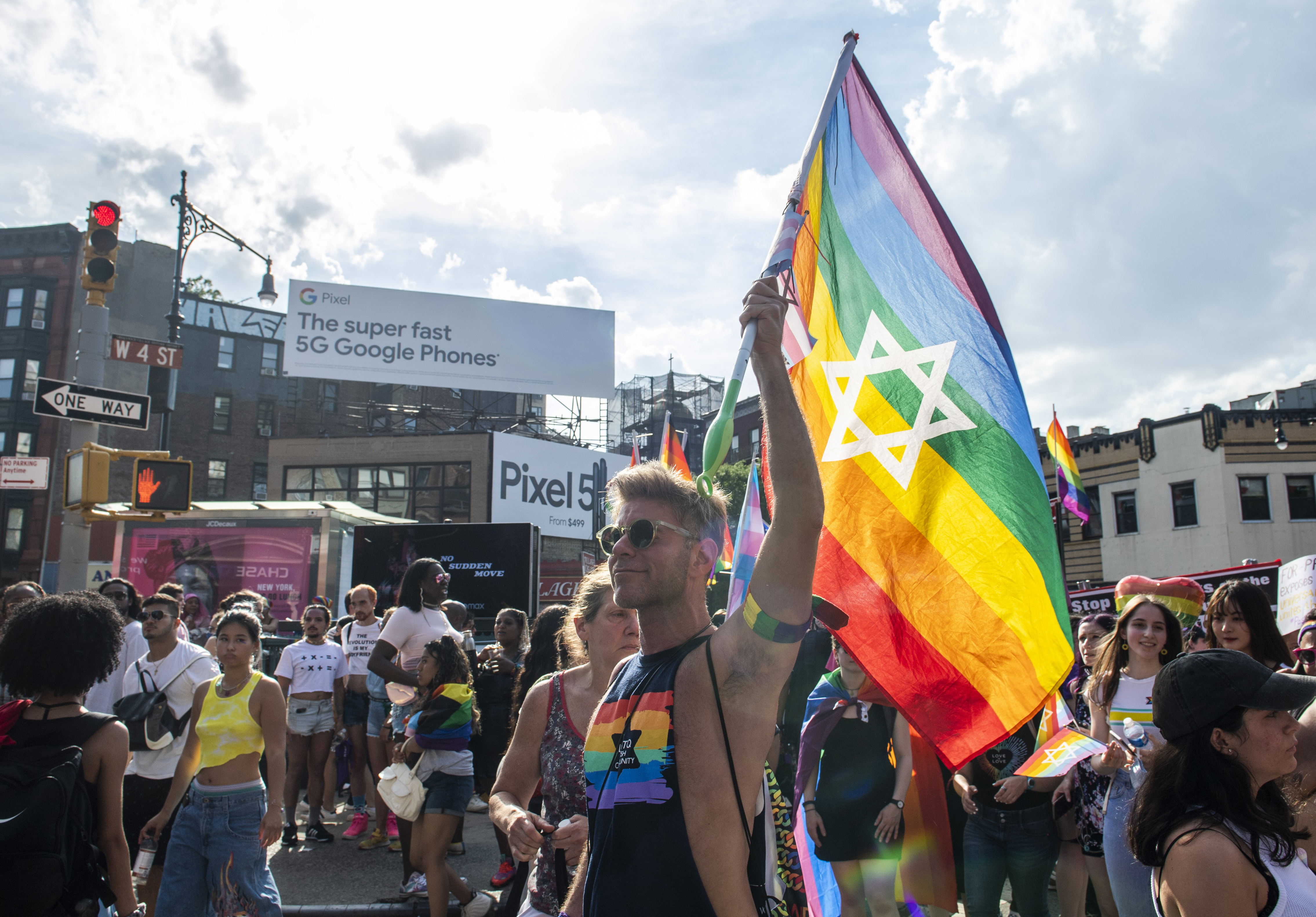 People gather during the Queer Liberation March in the West Village on Sunday, June 27, 2021, in New York. (AP Photo/Brittainy Newman)