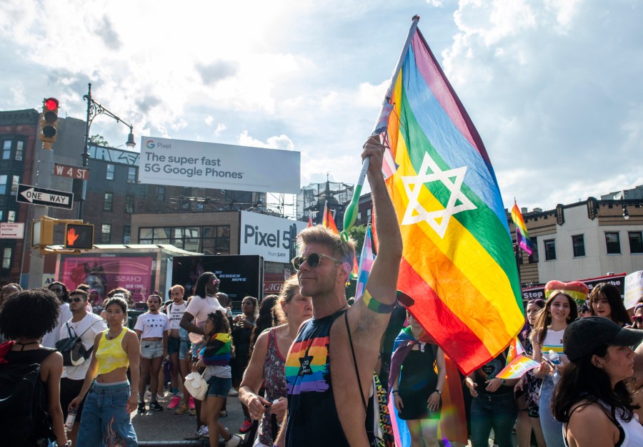 People gather during the Queer Liberation March in the West Village on Sunday, June 27, 2021, in New York. (AP Photo/Brittainy Newman)