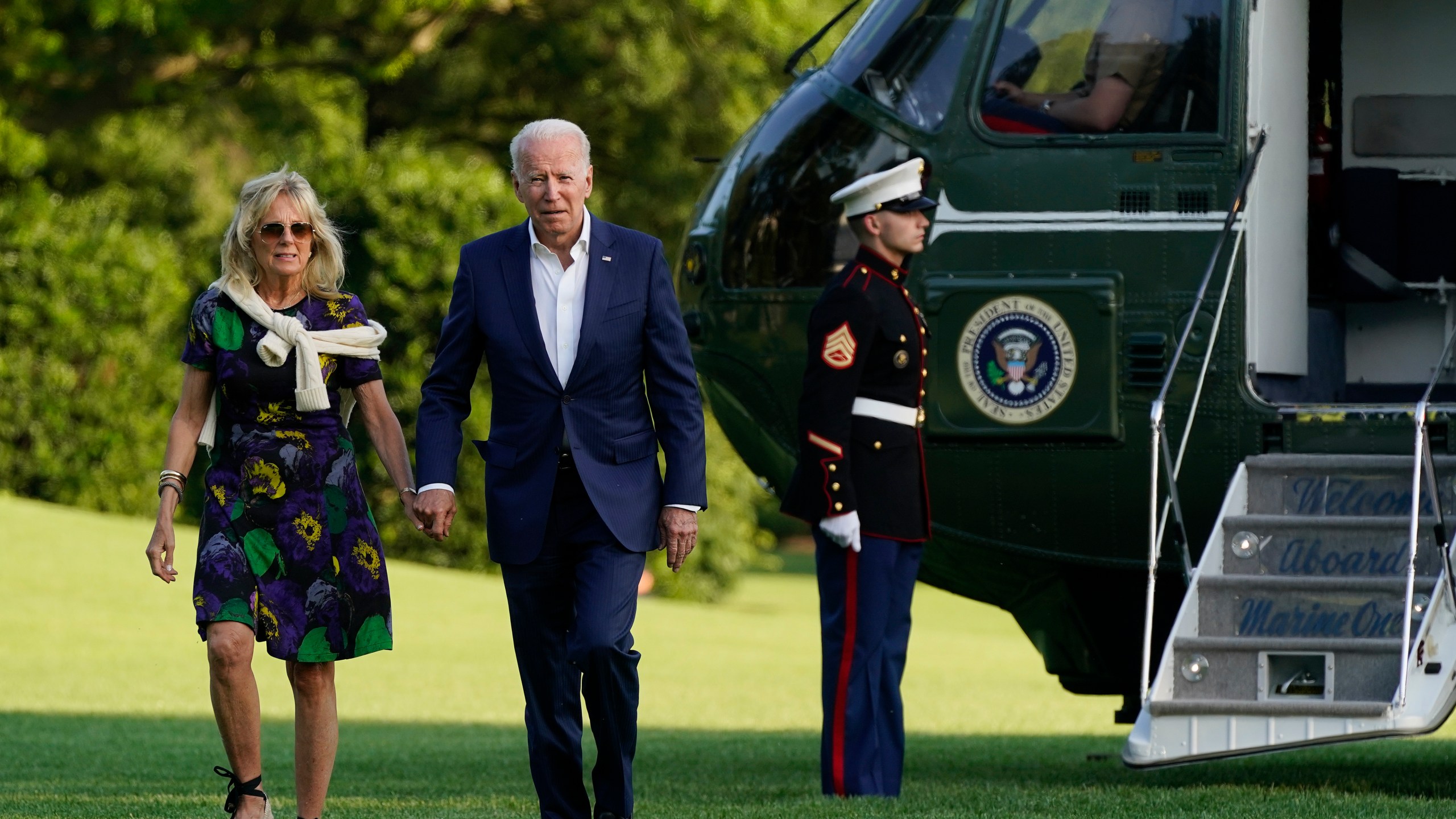 President Joe Biden and first lady Jill Biden walk on the South Lawn of the White House after stepping off Marine One, Sunday, June 27, 2021, in Washington. (AP Photo/Patrick Semansky)