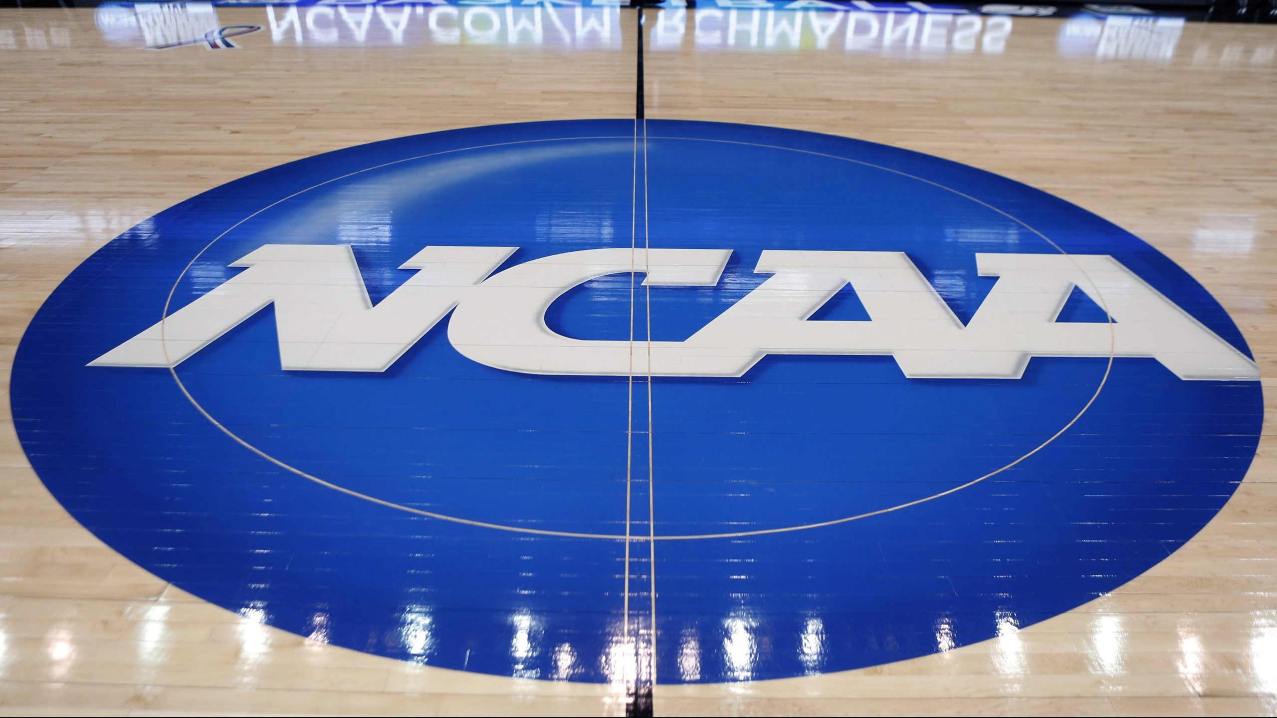 The NCAA logo is displayed at center court as work continues at The Consol Energy Center in Pittsburgh for the NCAA college basketball tournament on March 18, 2015. (Keith Srakocic / Associated Press)