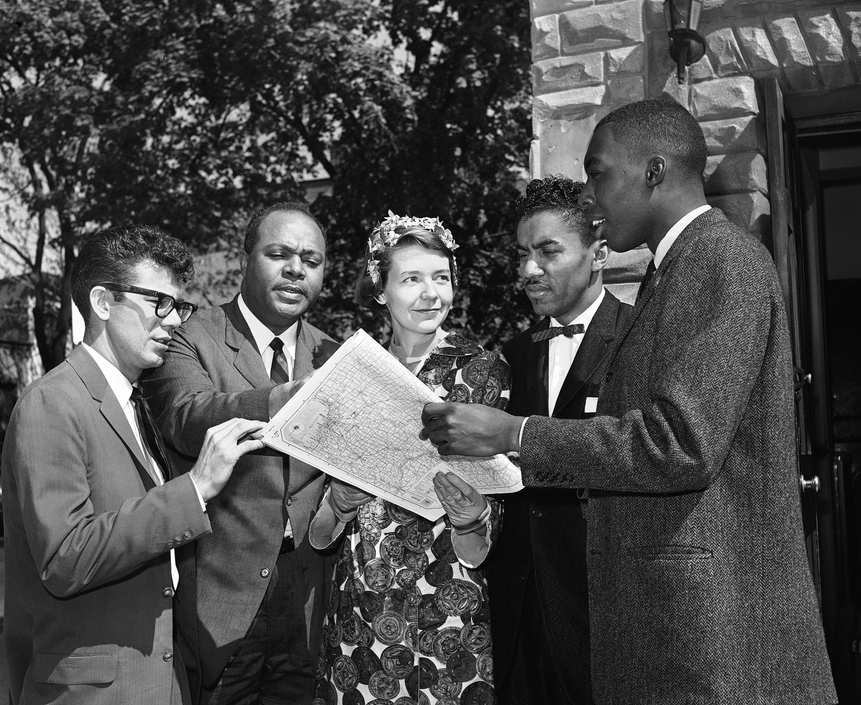 Members of an interracial group pose on May 4, 1961 in Washington with a map of a route they plan to take to test segregation in bus terminal restaurants and rest rooms in the South. (AP Photo/BHR)