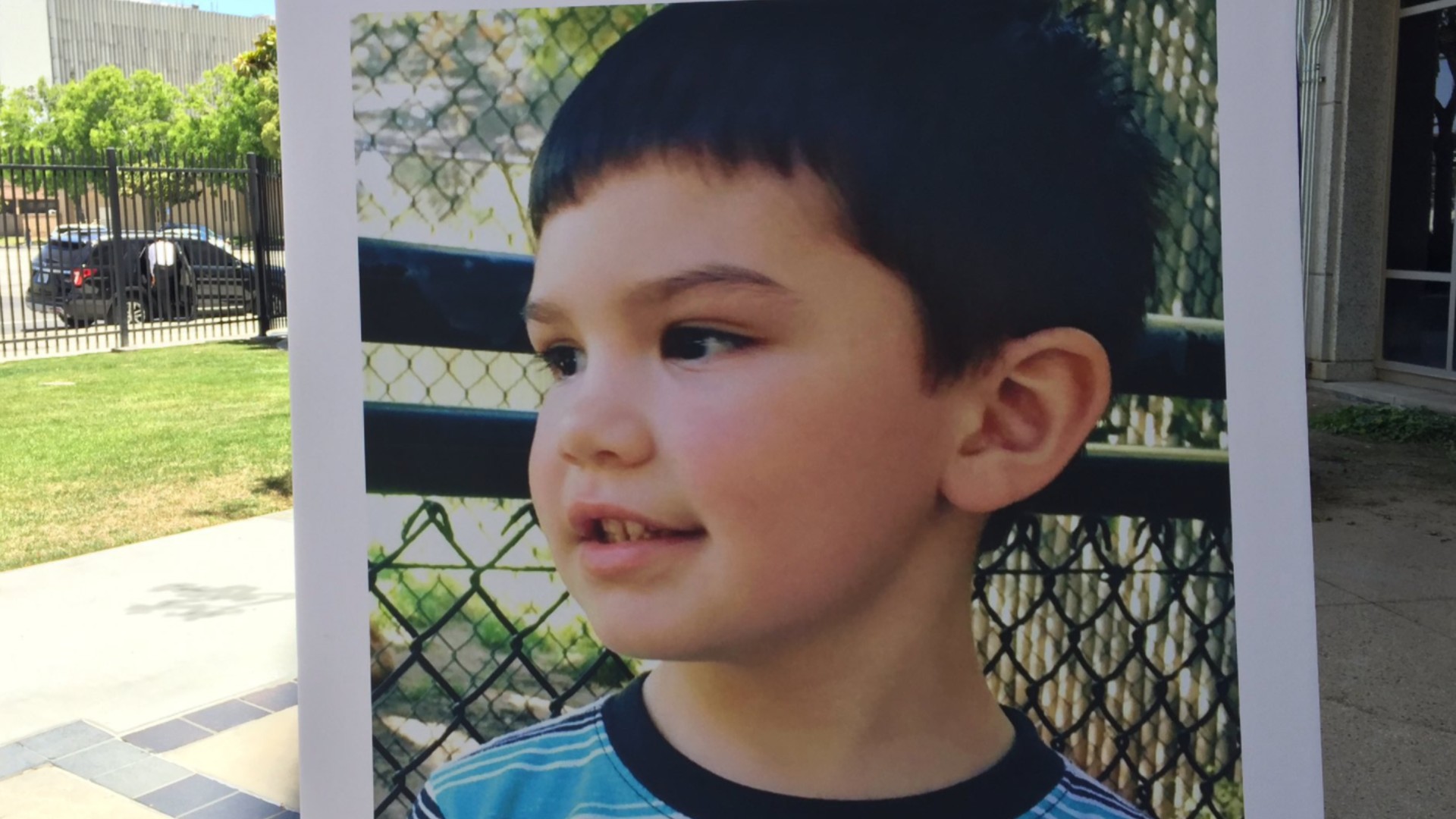 A photo of Aiden Leos is displayed at an Orange County District Attorney's Office news conference on June 8, 2021. (Todd Spitzer)