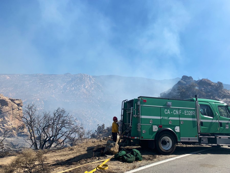 A firefighter standing next to a vehicle near the Flats Fire in Riverside County on June 14, 2021. (San Bernardino National Forest)