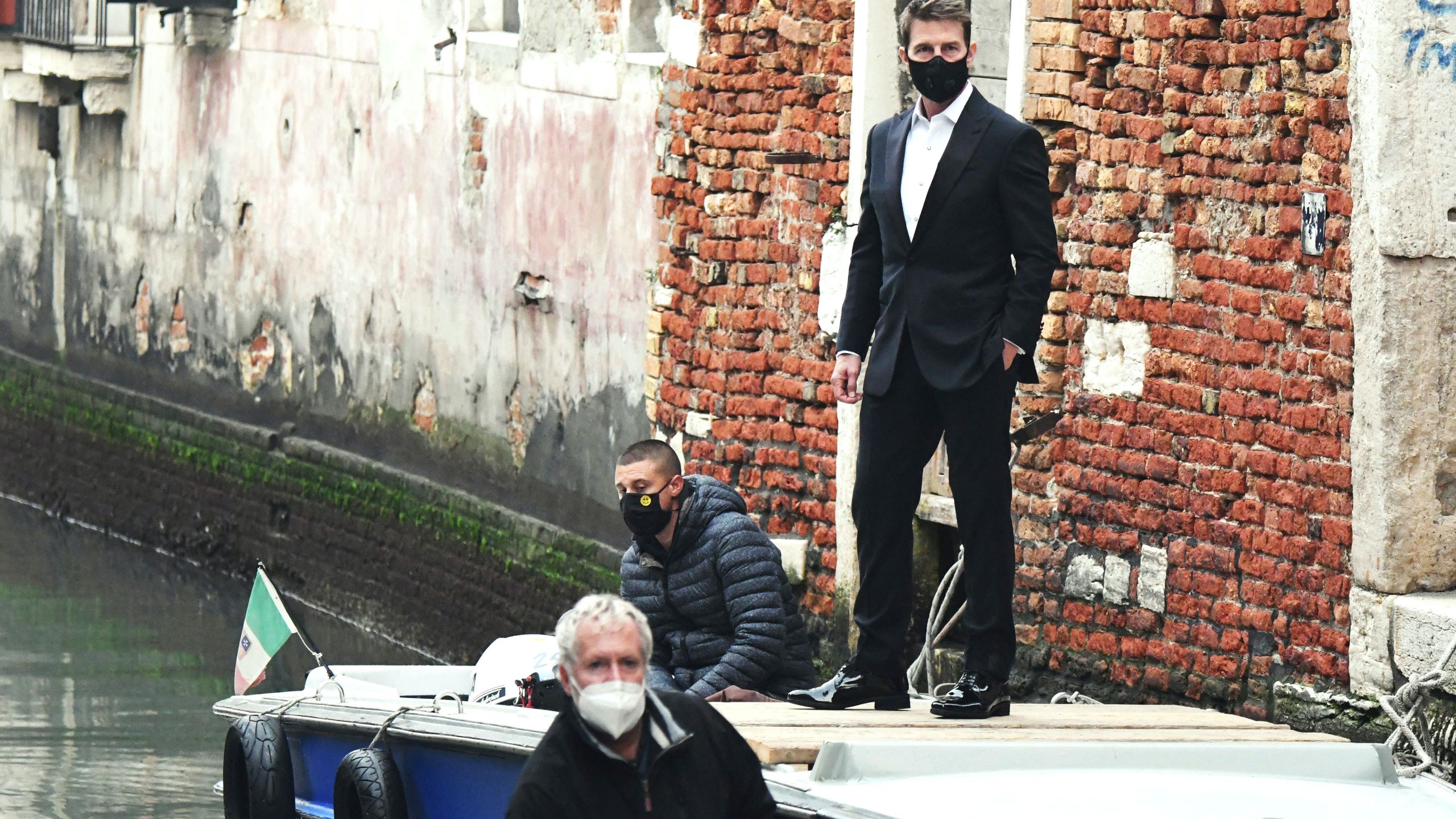 U.S. actor Tom Cruise stands on a boat during the shooting of the movie "Mission Impossible: Lybra" in Venice on Oct. 20, 2020. (ANDREA PATTARO / AFP via Getty Images)