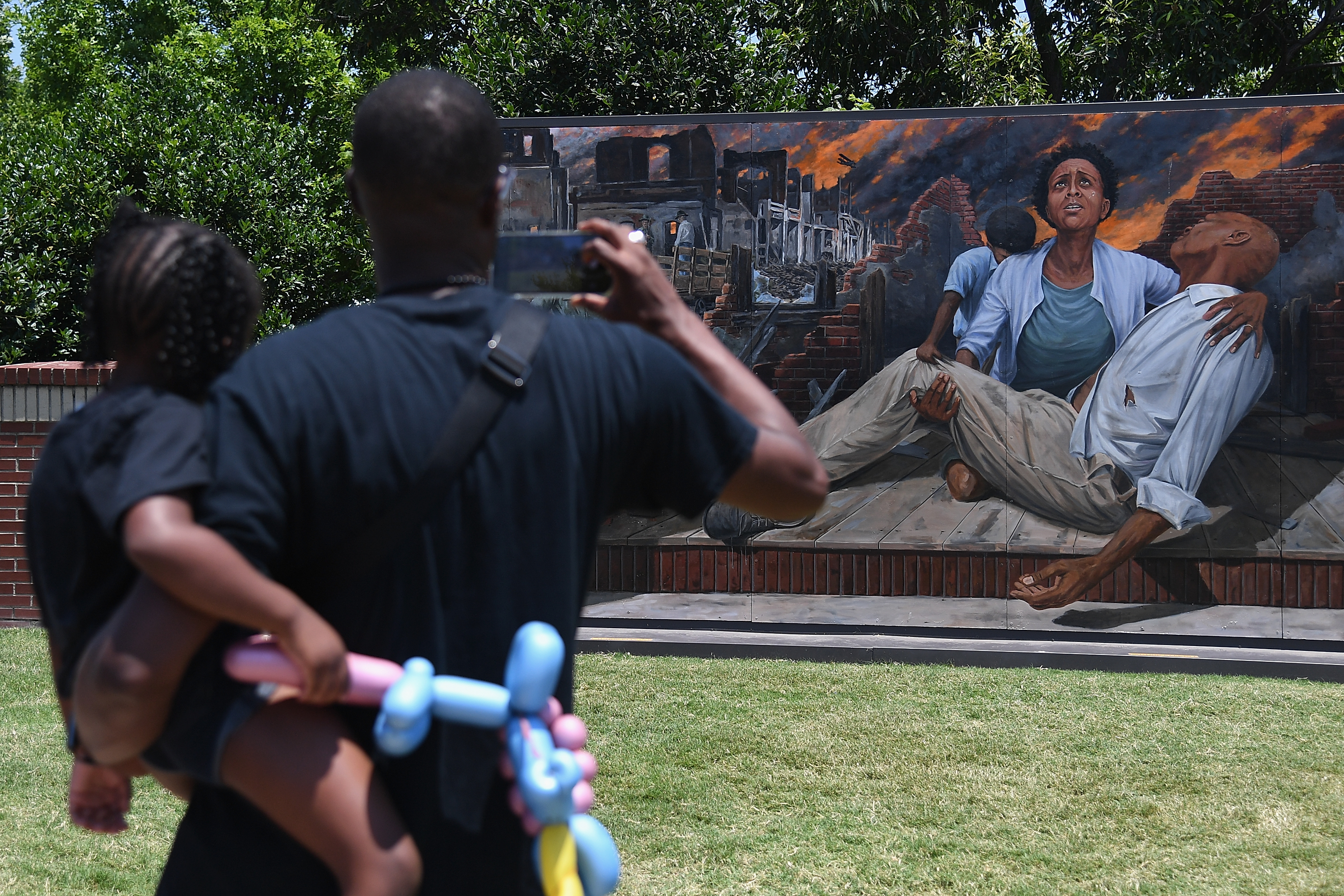 Attendees take in an art installation on Greenwood Avenue during the Juneteenth Festival on June 19, 2021 in Tulsa, Oklahoma. (Michael B. Thomas/Getty Images)