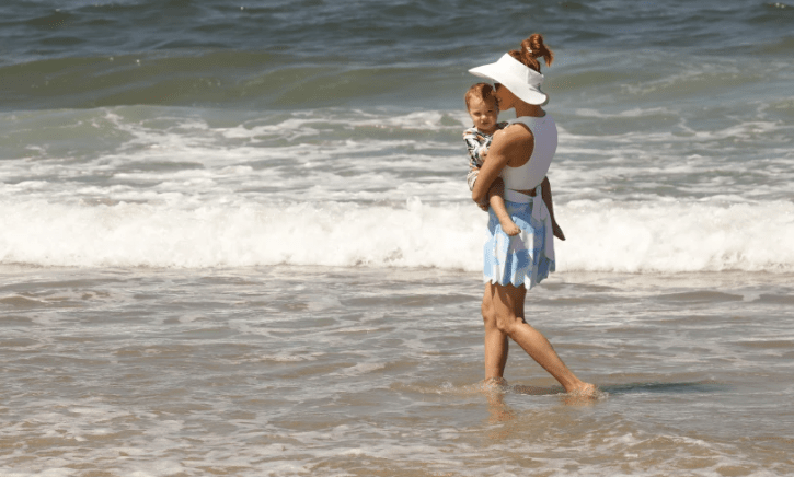 Amy Paffrath plays with daughter Ember Seeley, 1, in the surf at Playa del Rey on June 11.(Al Seib / Los Angeles Times)