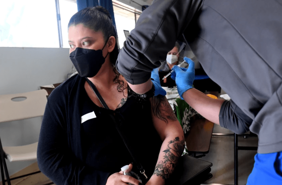 Magdalena Vargas receives a vaccine at a pop-up clinic in Hawaiian Gardens in April.(Wally Skalij / Los Angeles Times)