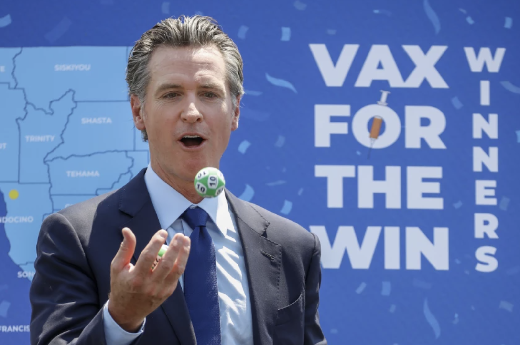 Gov. Gavin Newsom juggles numbered balls after a news conference at Universal Studios in June 2021.(Jay L. Clendenin / Los Angeles Times)