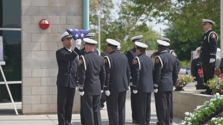 A flag ceremony was held in honor of fire fighting specialist Tory Carlon on June 15, 2021. (KTLA)