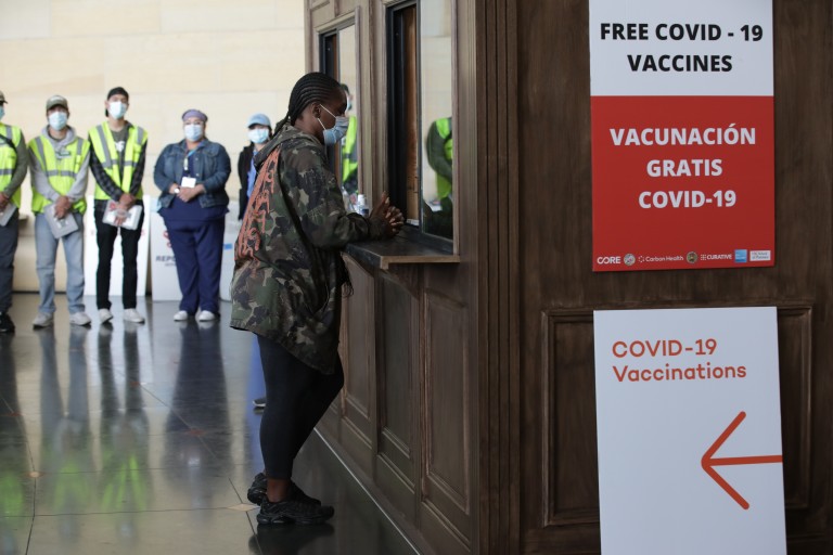 A woman visits a new COVID-19 vaccination site that opened June 8, 2021 at Union Station.