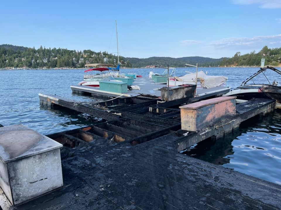 The aftermath of a fire that burned multiple boats and damaged a dock on Lake Arrowhead on July 16, 2021. (San Bernardino County Fire)