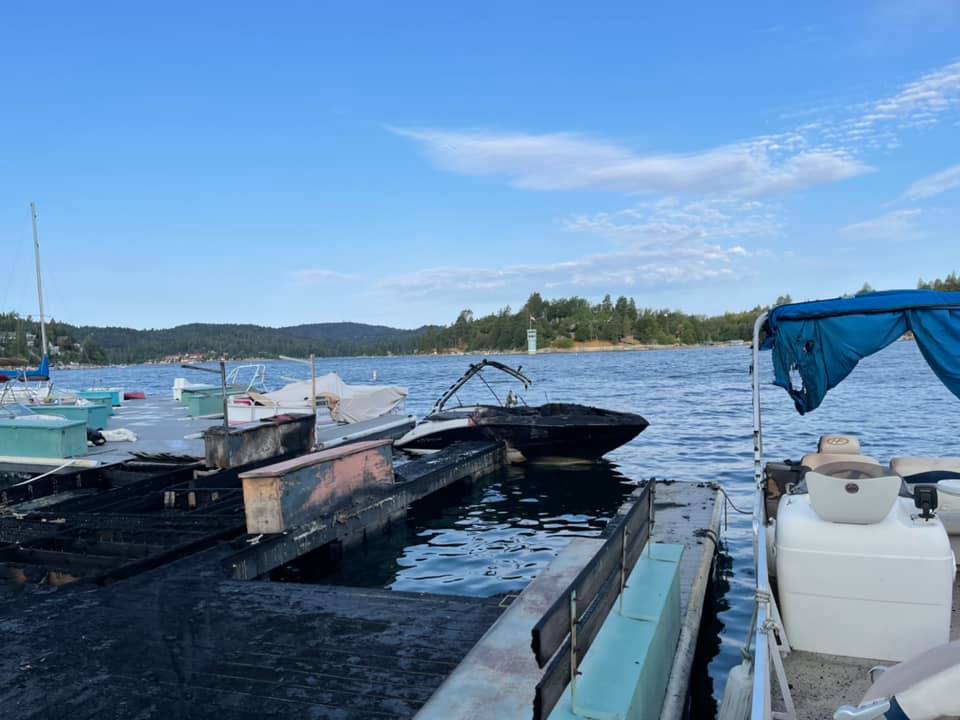 The aftermath of a fire that burned multiple boats and damaged a dock on Lake Arrowhead on July 16, 2021. (San Bernardino County Fire)