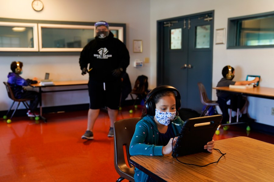 Los Angeles Unified School District students attend online classes at the Boys & Girls Club of Hollywood on Aug. 26, 2020. (Jae C. Hong / Associated Press)