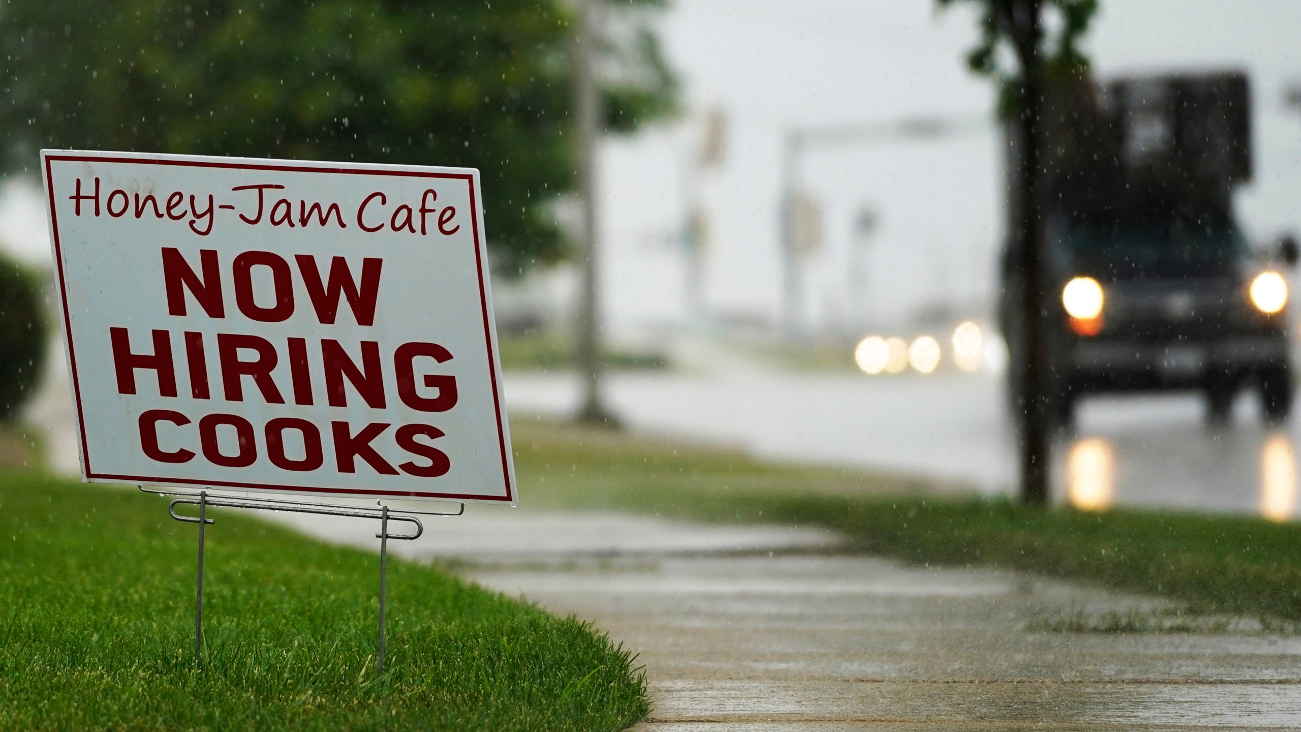 A hiring sign is shown in Downers Grove, Ill., Thursday, June 24, 2021. The number of Americans collecting unemployment benefits slid last week, another sign that the job market continues to recover rapidly from the coronavirus recession. Jobless claims dropped by 24,000 to 400,000 last week, the Labor Department reported Thursday, July 29, 2021. (AP Photo/Nam Y. Huh, File)