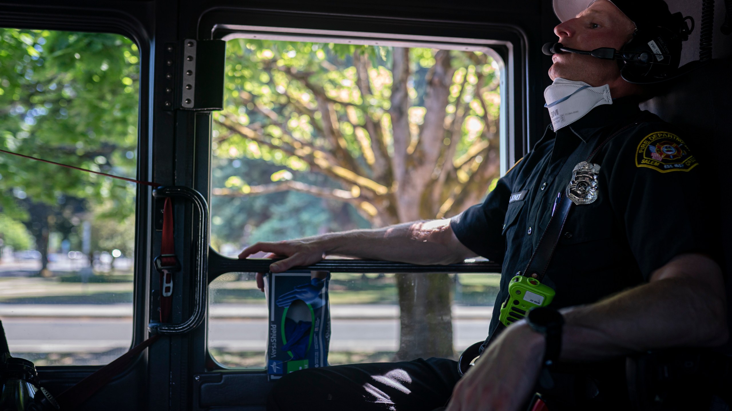 Salem Fire Department paramedic Justin Jones tries to stay cool after responding to a heat exposure call during a heat wave, Saturday, June 26, 2021, in Salem, Ore. (AP Photo/Nathan Howard)