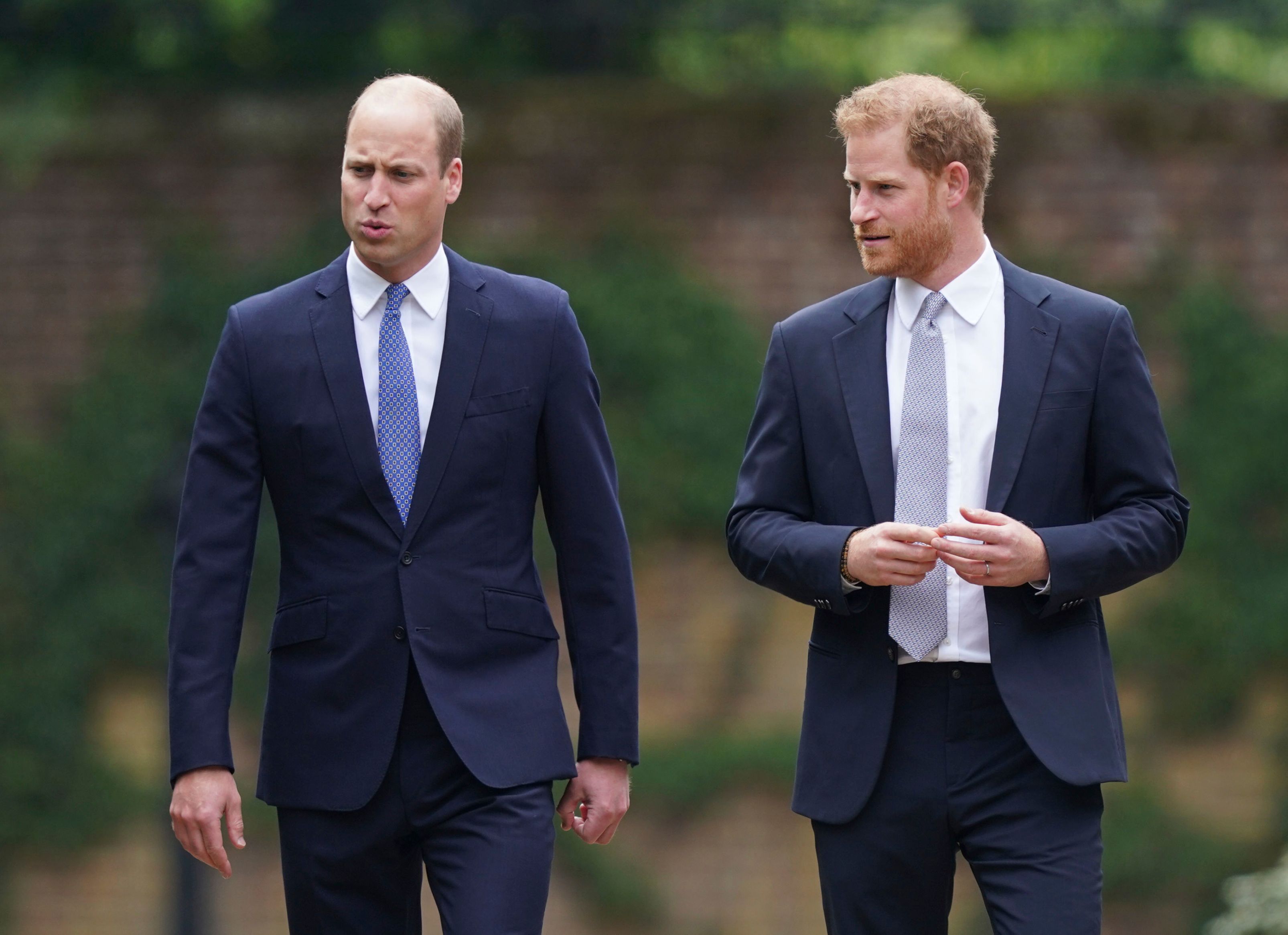 Britain's Prince William and Prince Harry arrive for the statue unveiling on what would have been Princess Diana's 60th birthday, in the Sunken Garden at Kensington Palace, London, Thursday July 1, 2021. (Yui Mok/Pool Photo via AP)