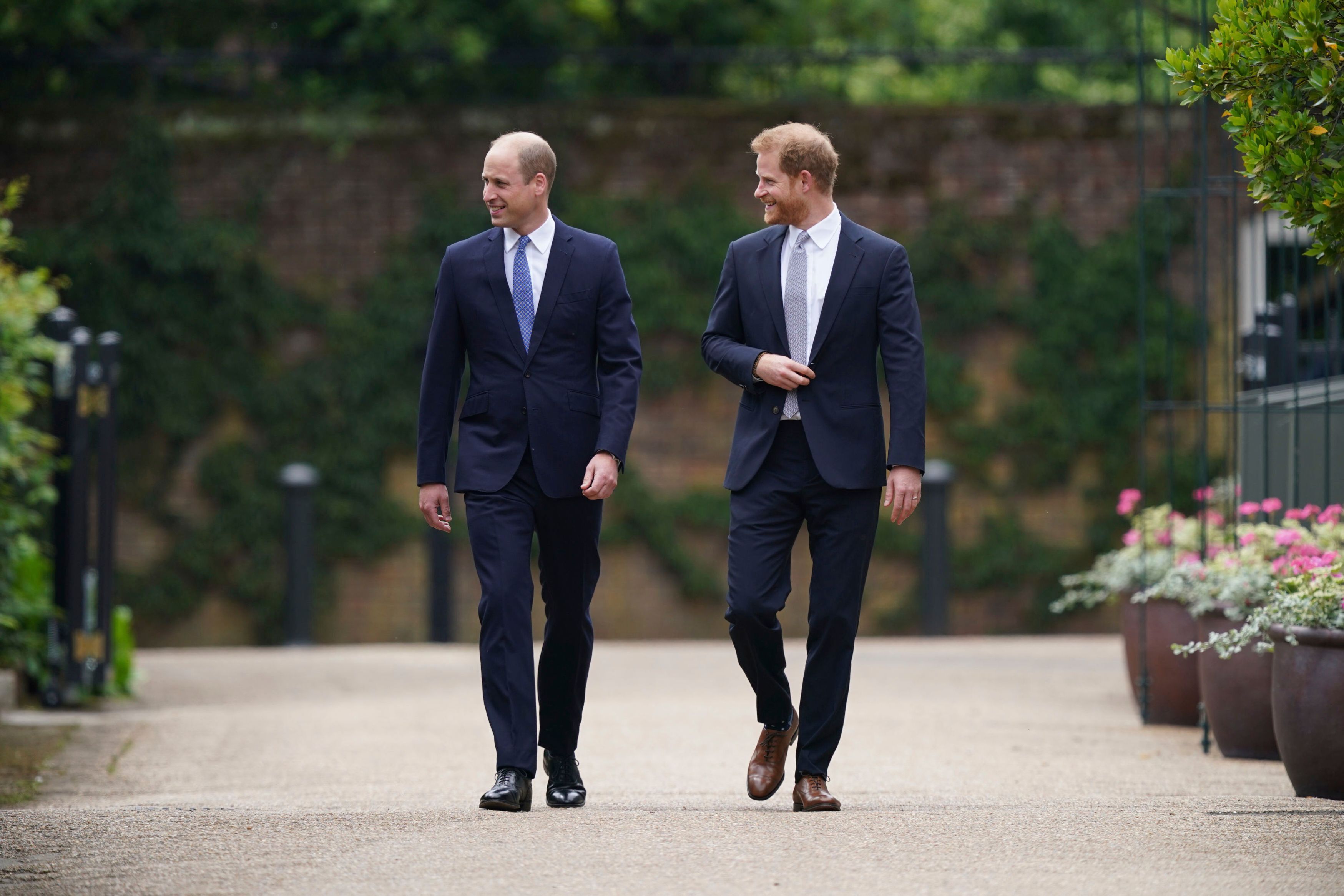 Britain's Prince William and Prince Harry arrive for the statue unveiling on what would have been Princess Diana's 60th birthday, in the Sunken Garden at Kensington Palace, London, Thursday July 1, 2021. (Yui Mok/Pool Photo via AP)