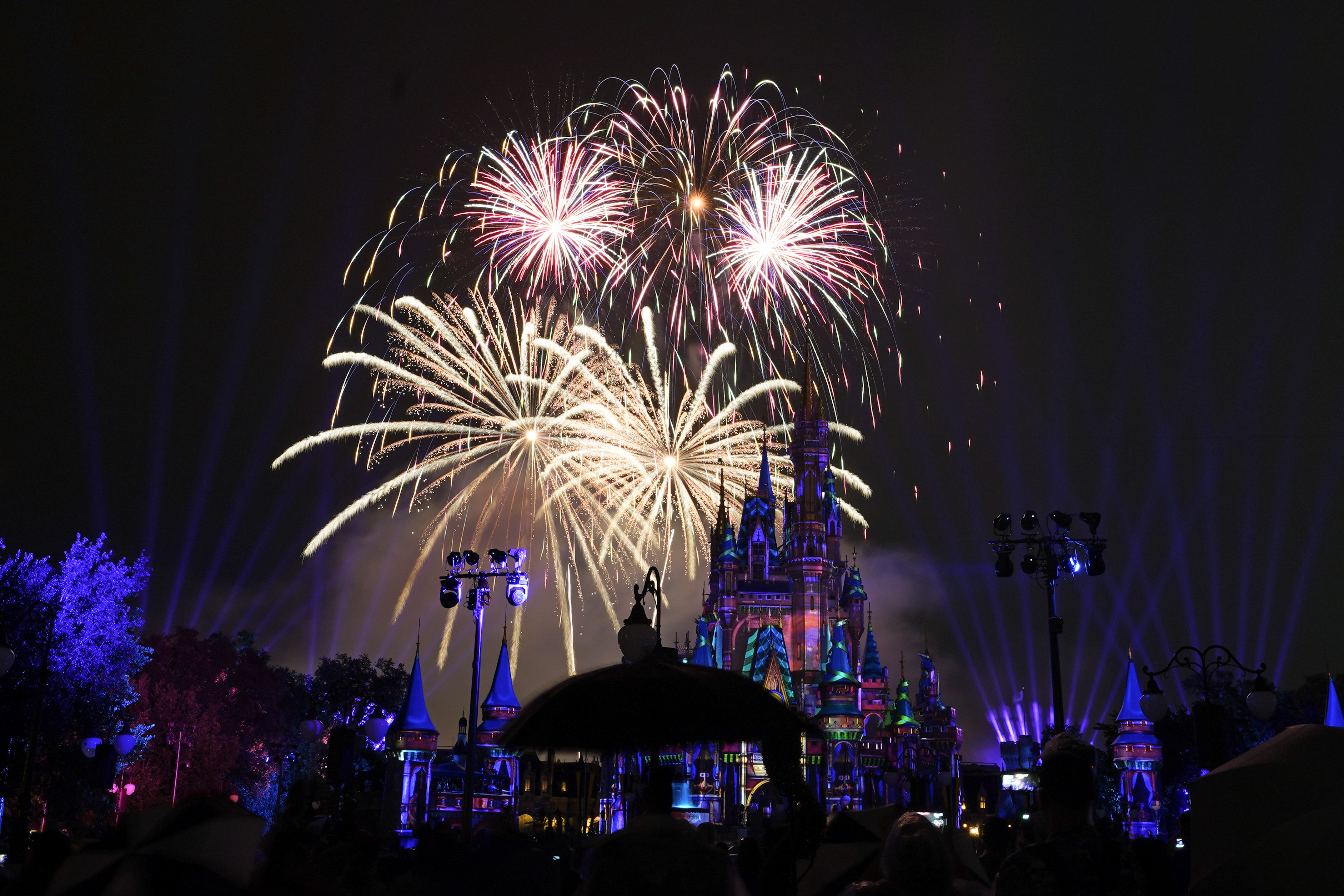 After a shutdown because of the coronavirus, fireworks fill the sky for the first time in 15 months at the Magic Kingdom at Walt Disney World in Lake Buena Vista, Fla., on July 1, 2021. (John Raoux / Associated Press)