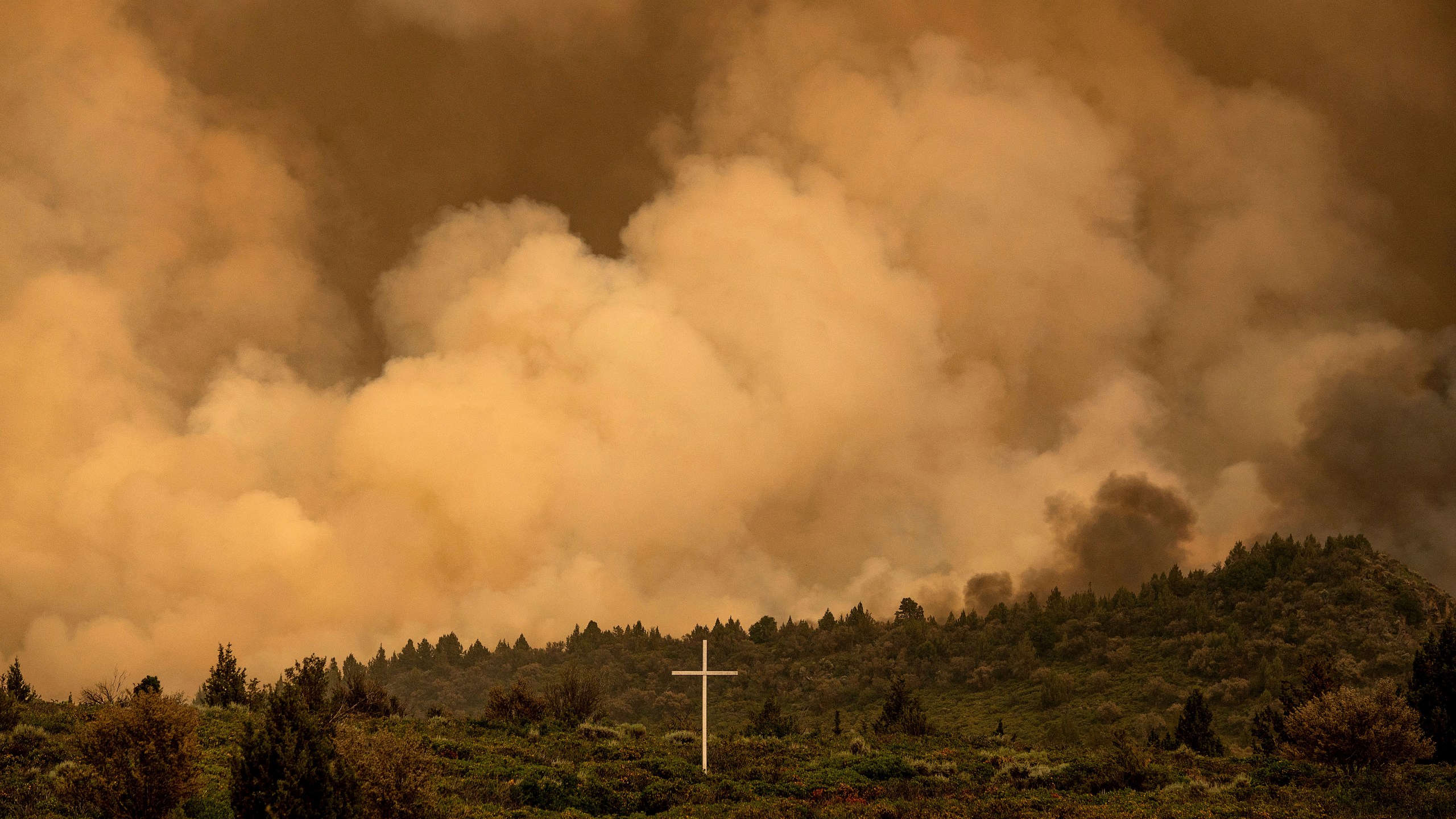 Smoke from the Lava Fire billows above Highway 97 in Weed, Calif., Thursday, July 1, 2021. Firefighters are battling multiple fires in the region following high temperatures and lightning strikes. (AP Photo/Noah Berger)