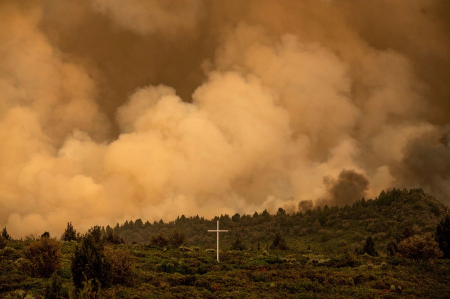 Smoke from the Lava Fire billows above Highway 97 in Weed, Calif., Thursday, July 1, 2021. Firefighters are battling multiple fires in the region following high temperatures and lightning strikes. (AP Photo/Noah Berger)