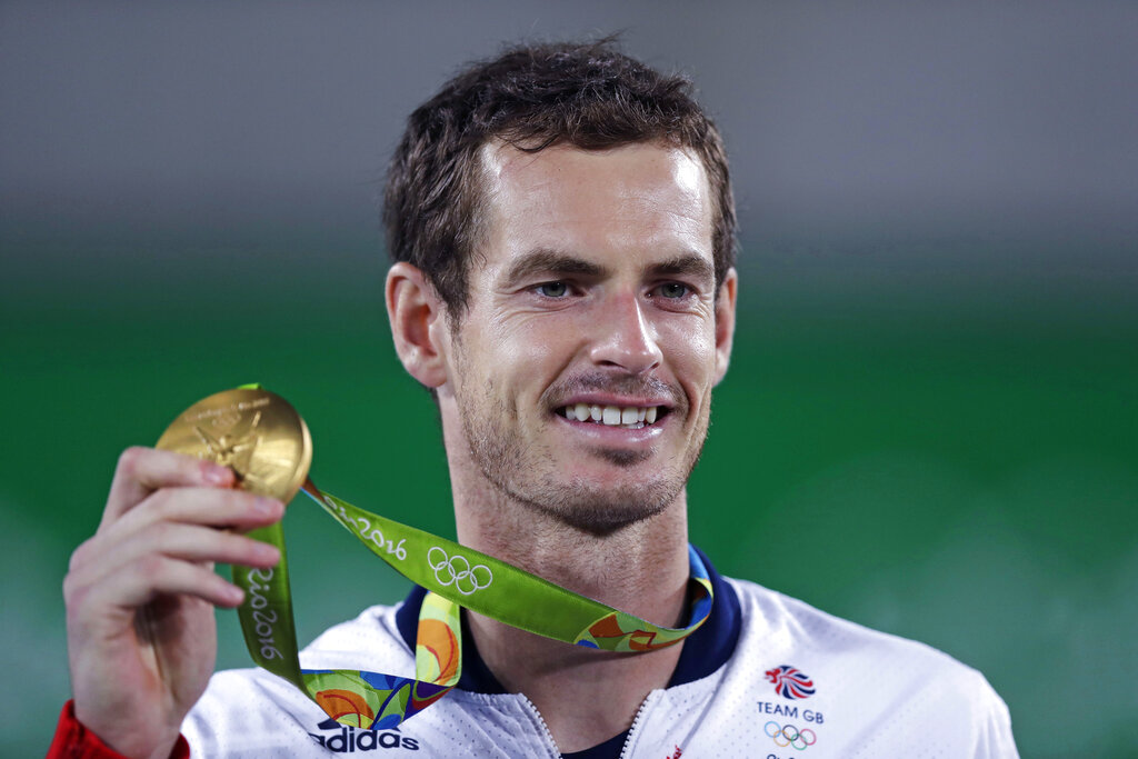 Andy Murray, of England, smiles as he holds up his gold medal at the 2016 Summer Olympics in Rio de Janeiro, Brazil, in this Sunday, Aug. 14, 2016, file photo. (AP Photo/Charles Krupa, File)