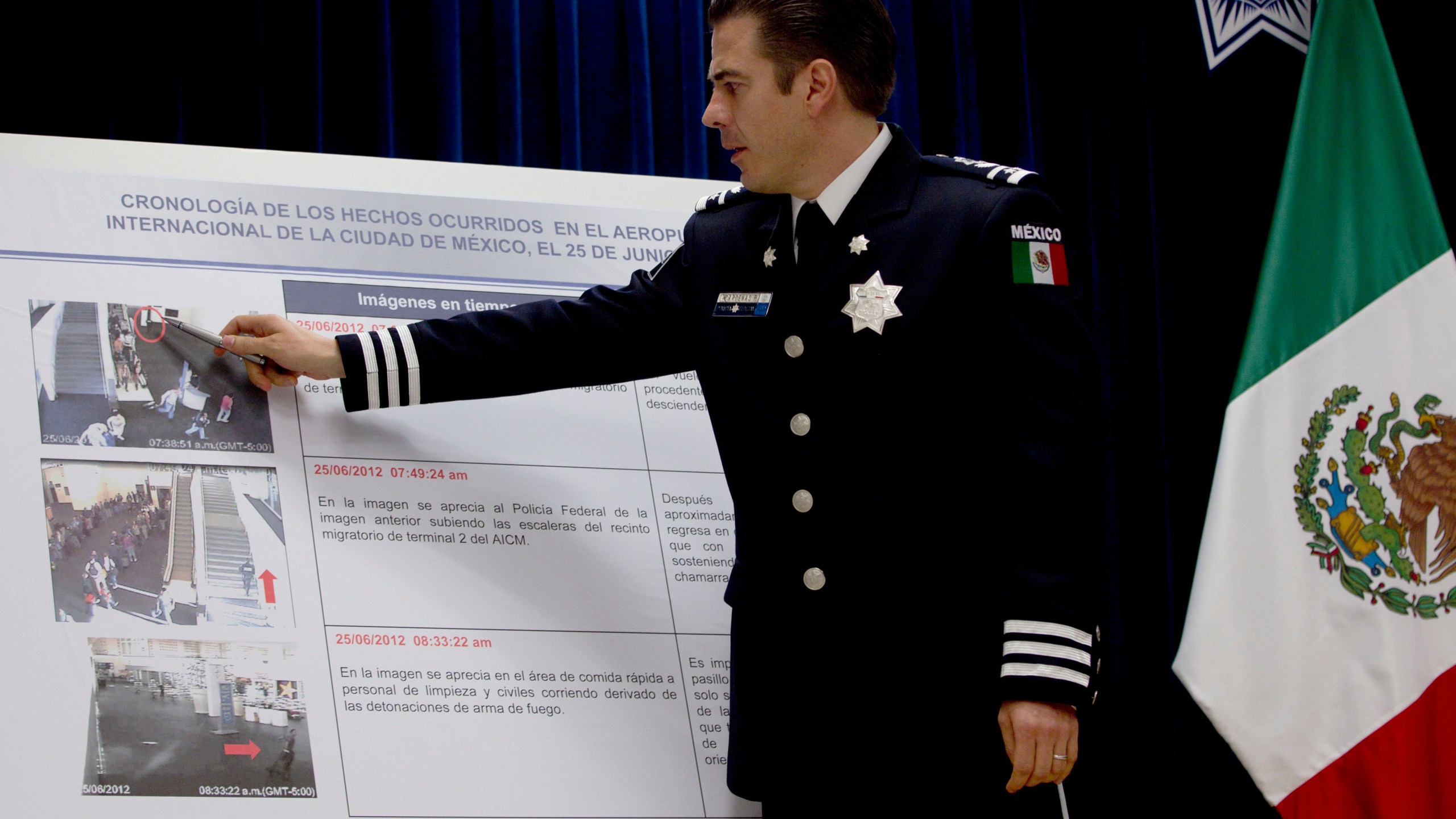 In this June 28, 2012 file photo, Luis Cardenas Palomino, chief of the regional security division of Mexico's federal police, points to surveillance camera footage at the international airport related to a shooting, during a press conference in Mexico City. Mexico said Monday, July 5, 2021, that it has arrested the former leading police officers on charges of torture from nearly a decade ago. (AP Photo/Esteban Felix, File)