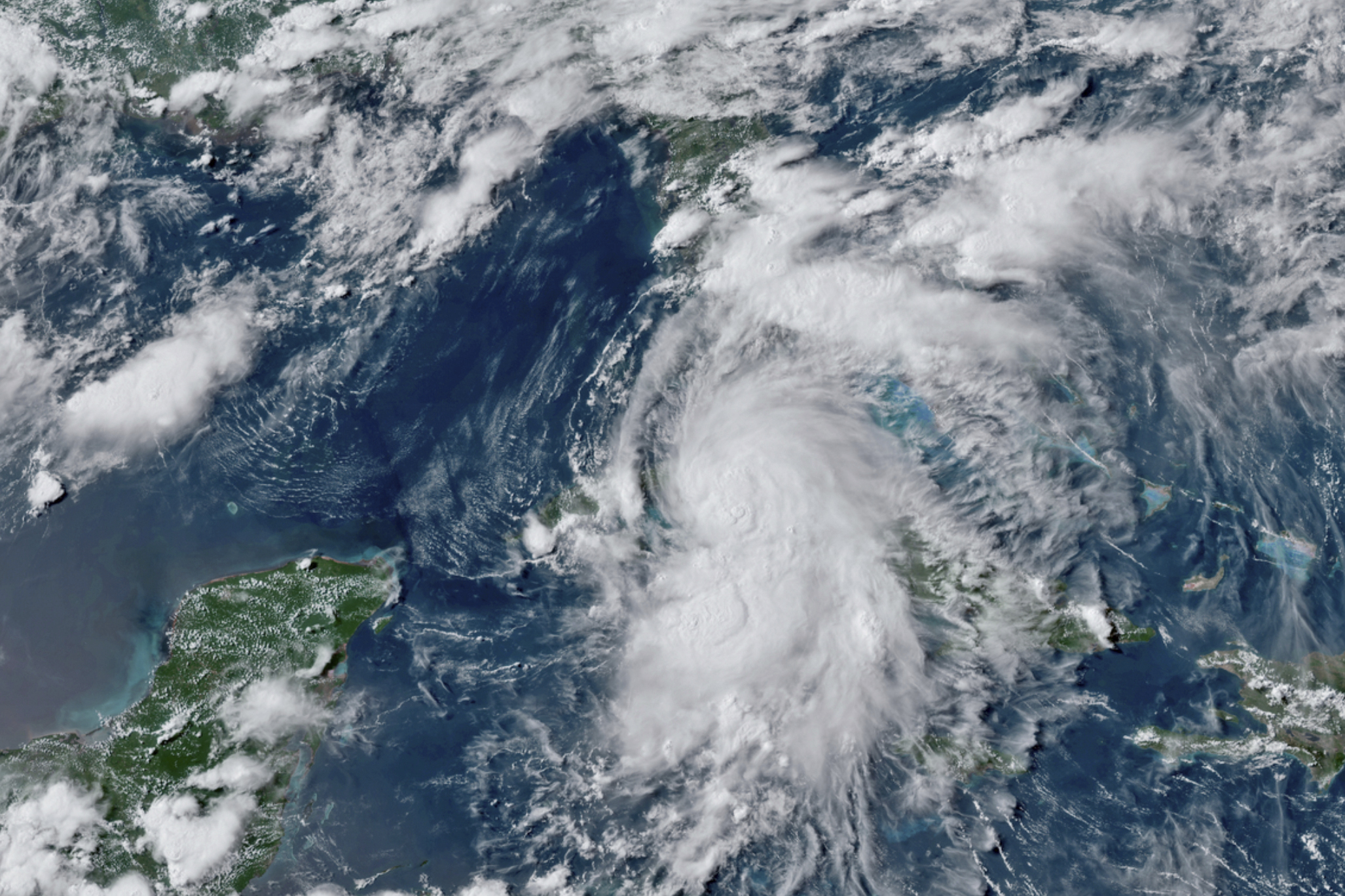 This GOES-16 GeoColor satellite image taken July 5, 2021, at 4:50 p.m. EDT, and provided by NOAA, shows Tropical Storm Elsa over western Cuba with strong rain and winds. (NOAA via Associated Press)