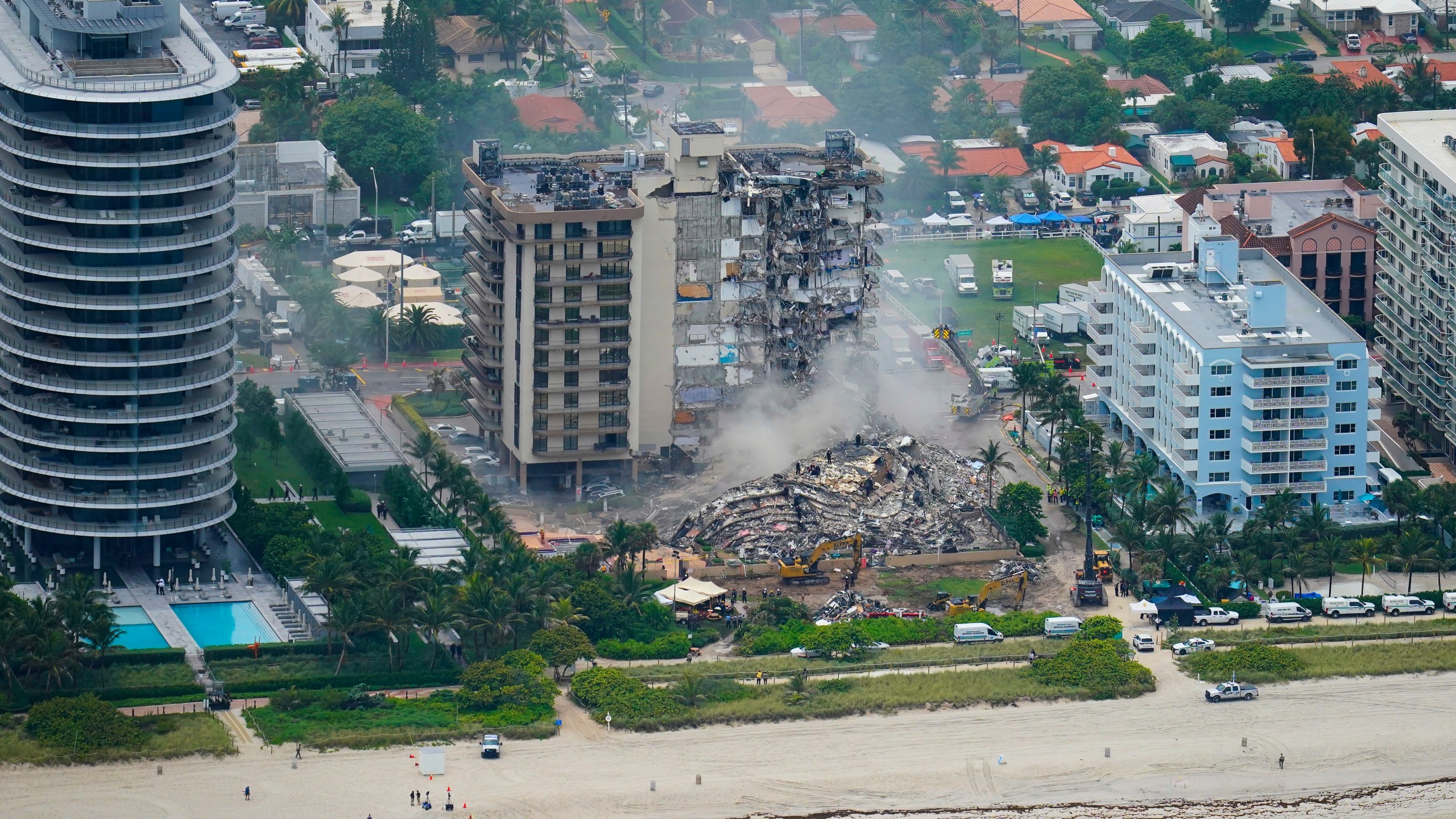 In this Friday, June 25, 2021, file photo, rescue personnel work in the rubble at the Champlain Towers South Condo, in Surfside, Fla. Even as the search continues over a week later for signs of life in the mangled debris of the fallen Champlain Towers South, the process of seeking answers about why it happened and who is to blame is already underway in Florida's legal system. (AP Photo/Gerald Herbert, File)