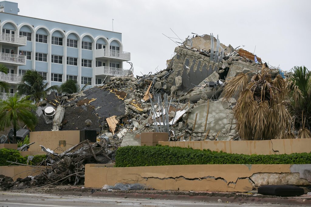 Rubble and debris of the Champlain Towers South condo can be seen Tuesday, July 6, 2021 in Surfside, Fla. (Carl Juste/Miami Herald via AP)