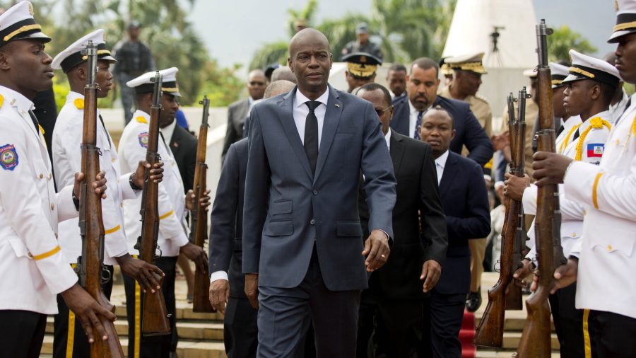 Haiti's President Jovenel Moise, center, leaves the museum during a ceremony marking the 215th anniversary of revolutionary hero Toussaint Louverture's death, at the National Pantheon museum in Port-au-Prince, Haiti, on April 7, 2018. (Dieu Nalio Chery / Associated Press)