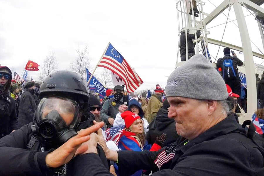 In this Jan. 6, 2021, image from video, Alan William Byerly, right, is seen allegedly attacking an Associated Press photographer during a riot at the U.S. Capitol in Washington. (AP Photo/Julio Cortez)