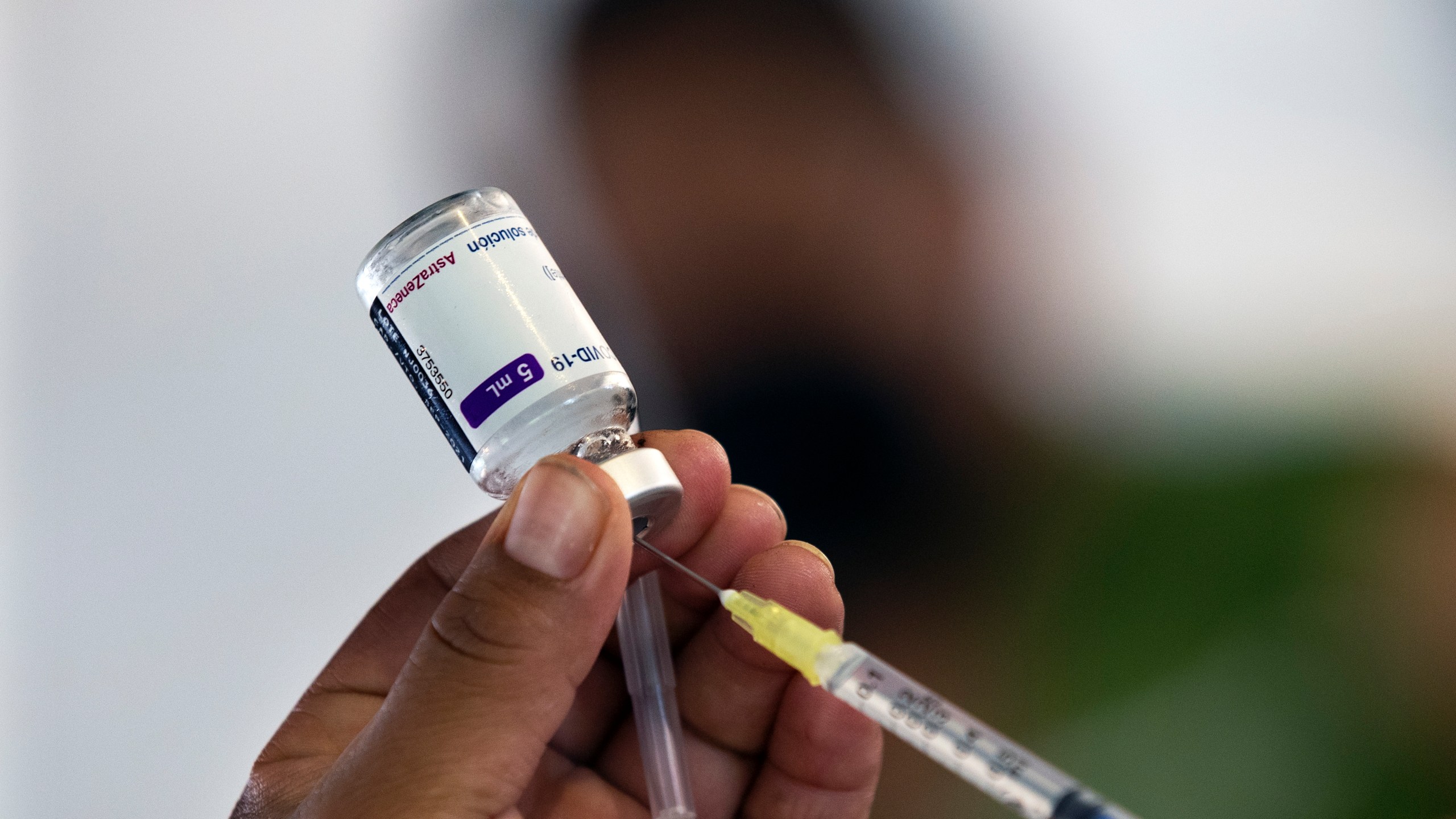 A health worker prepares to administer a jab of the AstraZeneca COVID-19 vaccine during a vaccination drive for people ages 30 to 39 in Mexico City, July 7, 2021. (Marco Ugarte/Associated Press)