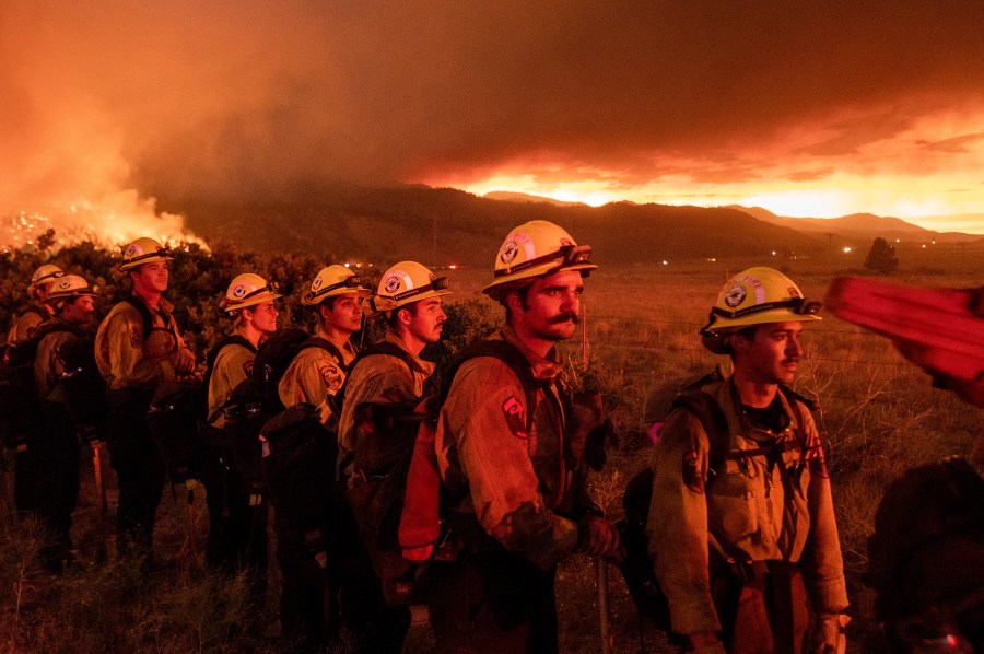 Firefighters from Cal Fire's Placerville station monitor the Sugar Fire, part of the Beckwourth Complex Fire, in Doyle, Calif., on Friday, July 9, 2021. (AP Photo/Noah Berger)